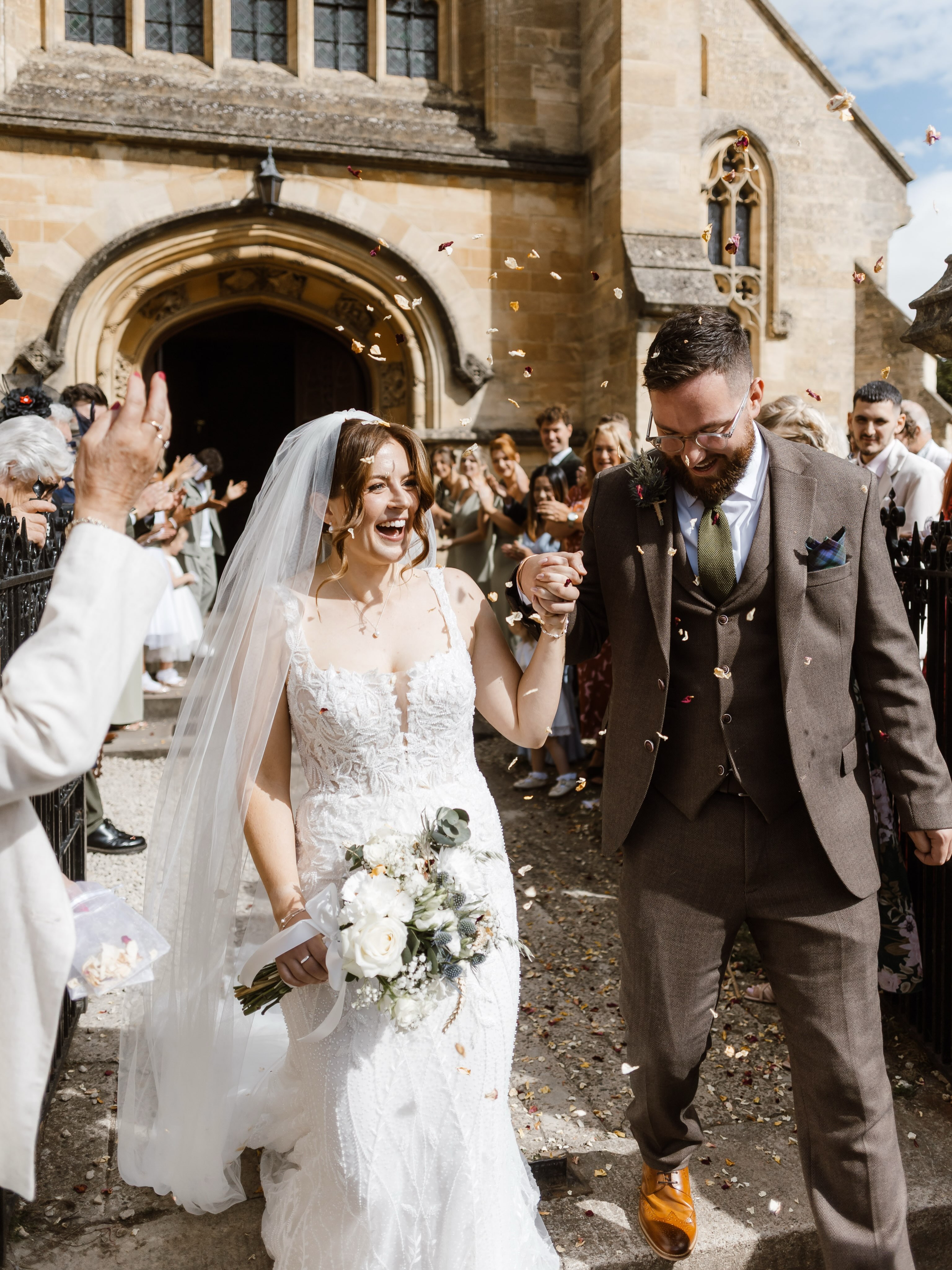 Can you believe it’s sparkler season already!?
Katie and John’s superb wedding at Mickleton Hills Farm yesterday was an incredible effort from everyone involved - especially Katie, who created the prettiest floral arrangements. Alongside roses, collected glass bottles and milk churns, she incorporated dried corn from Dad’s farm and thistles as a nod to John’s Scottish heritage. 🌾
The two tied the knot at the beautiful Parish Church in Chipping Campden before celebrating at one of my favourite venues, Mickleton Hills Farm.
These guys clearly know how to do a wedding. The magic of Mickleton is that the place is yours for the whole weekend, so you can set up and settle into the space the day before, and still be floating around the venue the day after. It makes for such a relaxed bridal party.
And these two just make total sense as a couple. After around 10 years together, they’ve built a rich circle of friendships around them, which made the whole day feel wonderfully warm.
Katie’s beaded dress elegantly draped around her and was perfect for this changing season. She looked magnificent, that dress was made for her.
Photographer : @amyrosedeffley
Venue: @mickletonhillsfarm
Flowers: Katie (Bride)
Live Illustrator: @paintbygingers
Dress: @annabelsarahbridal
Hair: @hairdressingbyameliaxo
Makeup: @makeupinthecotswolds
Band: @timloveguitar
Cake: Anne (Mum)
Caterers: @berrybluecatering
Dress Alterations: @md_bridal_alterations