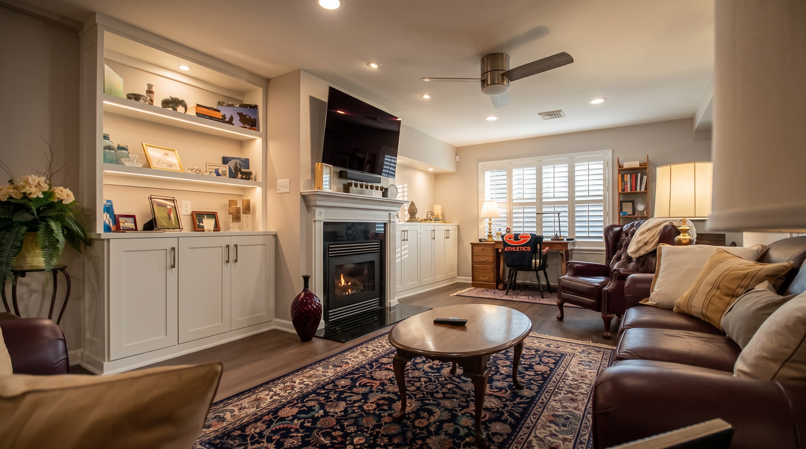 Basement refresh. We replaced the drop ceiling with drywall, replaced the carpet with luxury vinyl planks, added custom, illuminated cabinetry, new recessed lighting and painted the entire space. Simple upgrades make a BIG impact and can make a “basement” living space feel more like a “lower living level”.