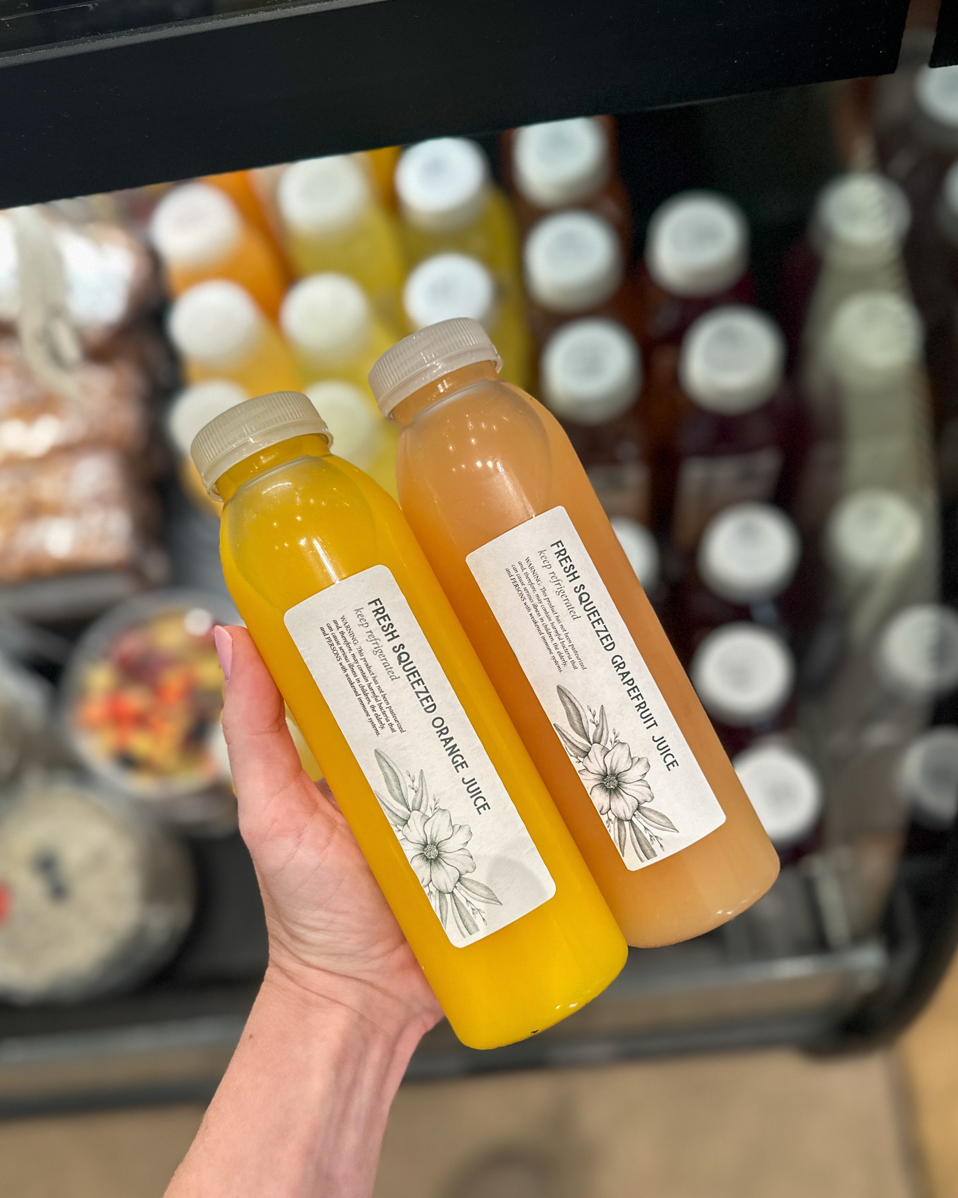 Your morning juice, without the squeezing. Fresh orange + grapefruit juice stocked and ready to grab.