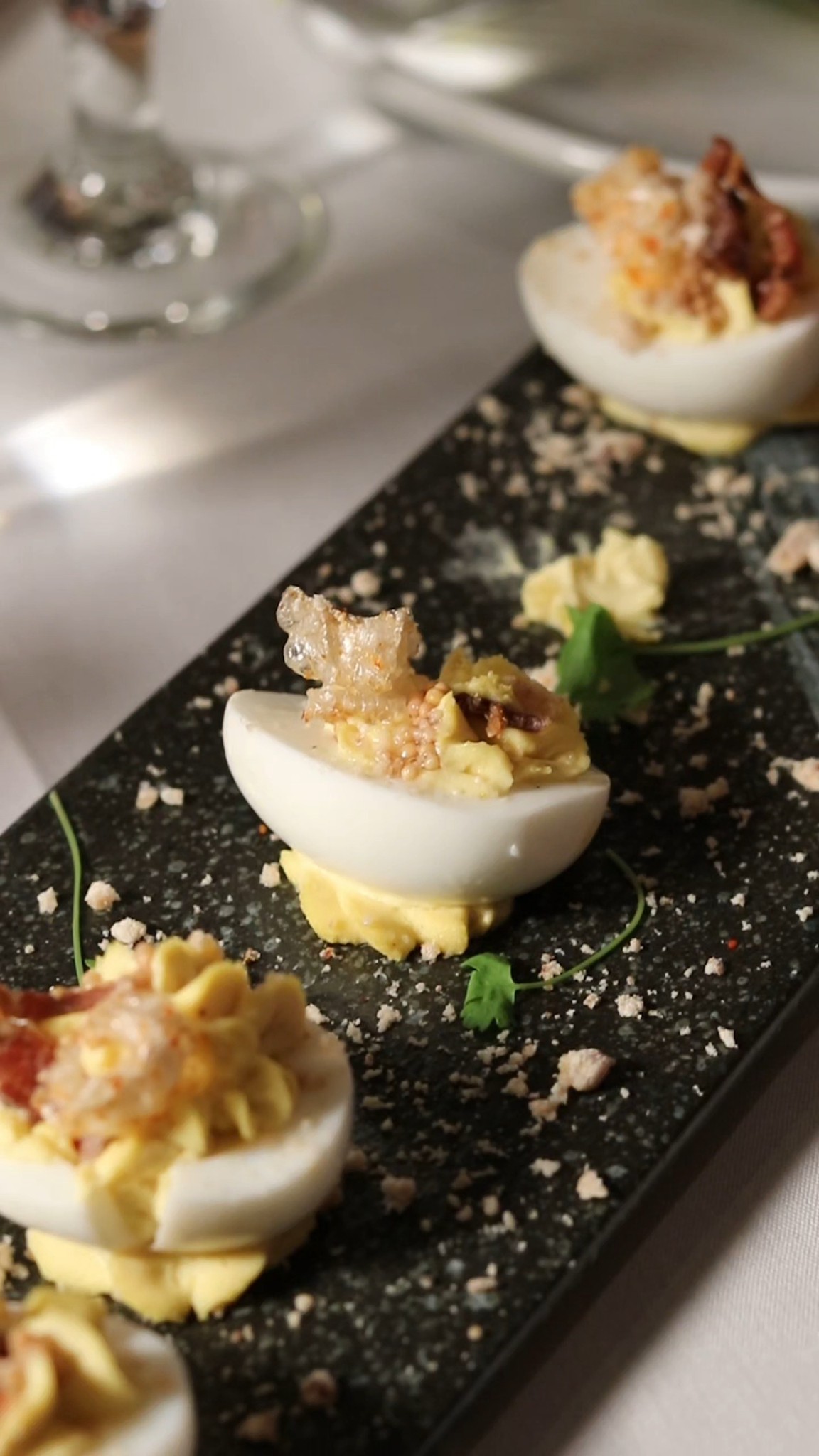 Five halves with a Nick and Sam’s twist in the deviled egg filling.
Underneath the classic yolk mixture (egg, mayo, Dijon, a touch of sriracha) sits house-made salmon rillettes made from ora king salmon poached in white wine. Then it's finished with salmon roe and crispy chicken skin dusted in togarashi sugar for a crunch you don't expect!
📍 Uptown Dallas | Reserve via link in bio.
#NickAndSams #DallasDining #UptownDallas #DallasRestaurants