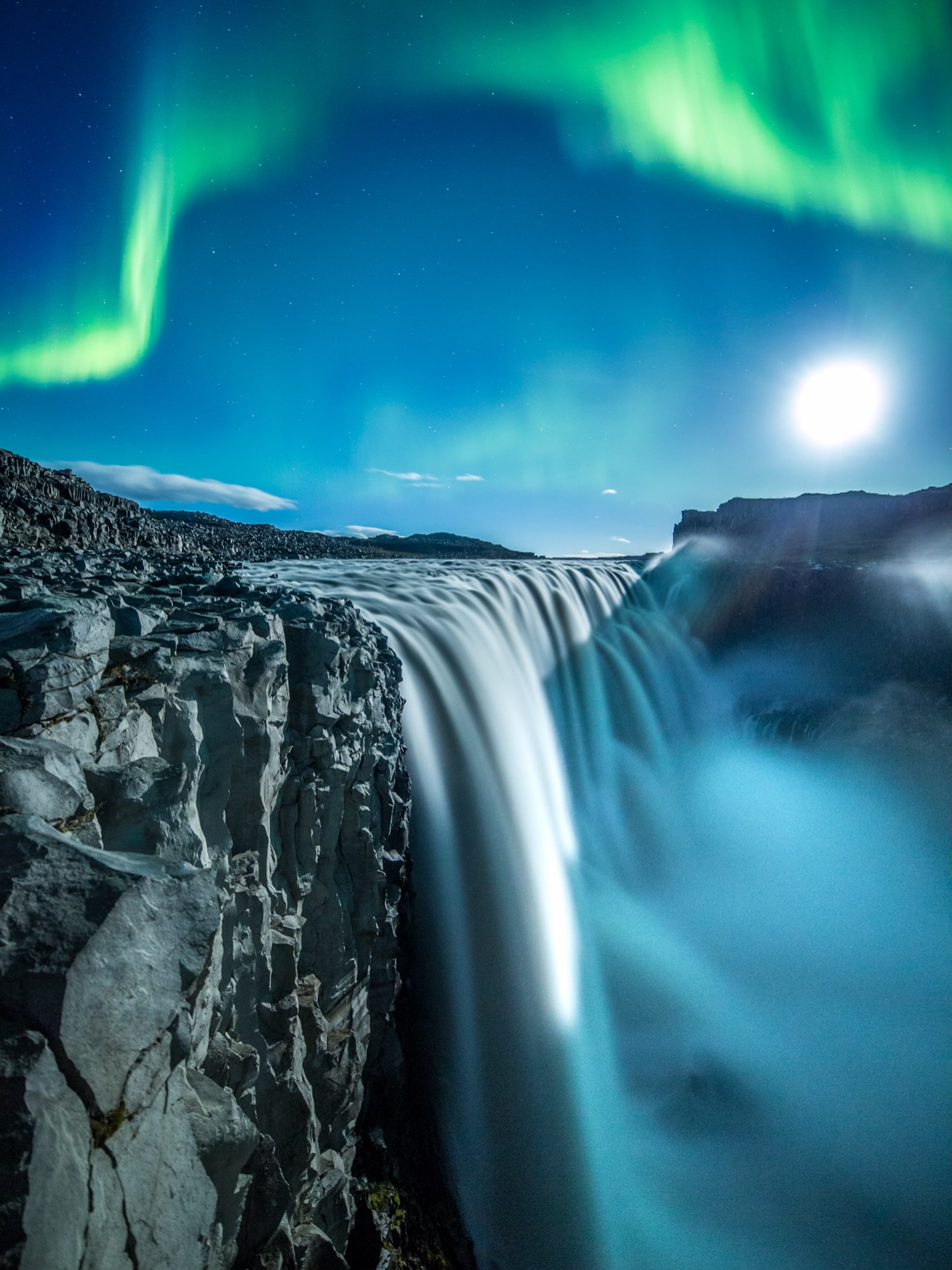 The Northern lights and the moon create incredible art in #iceland Planning this photo took years and great teamwork #adventure #photography #myvatn #northiceland