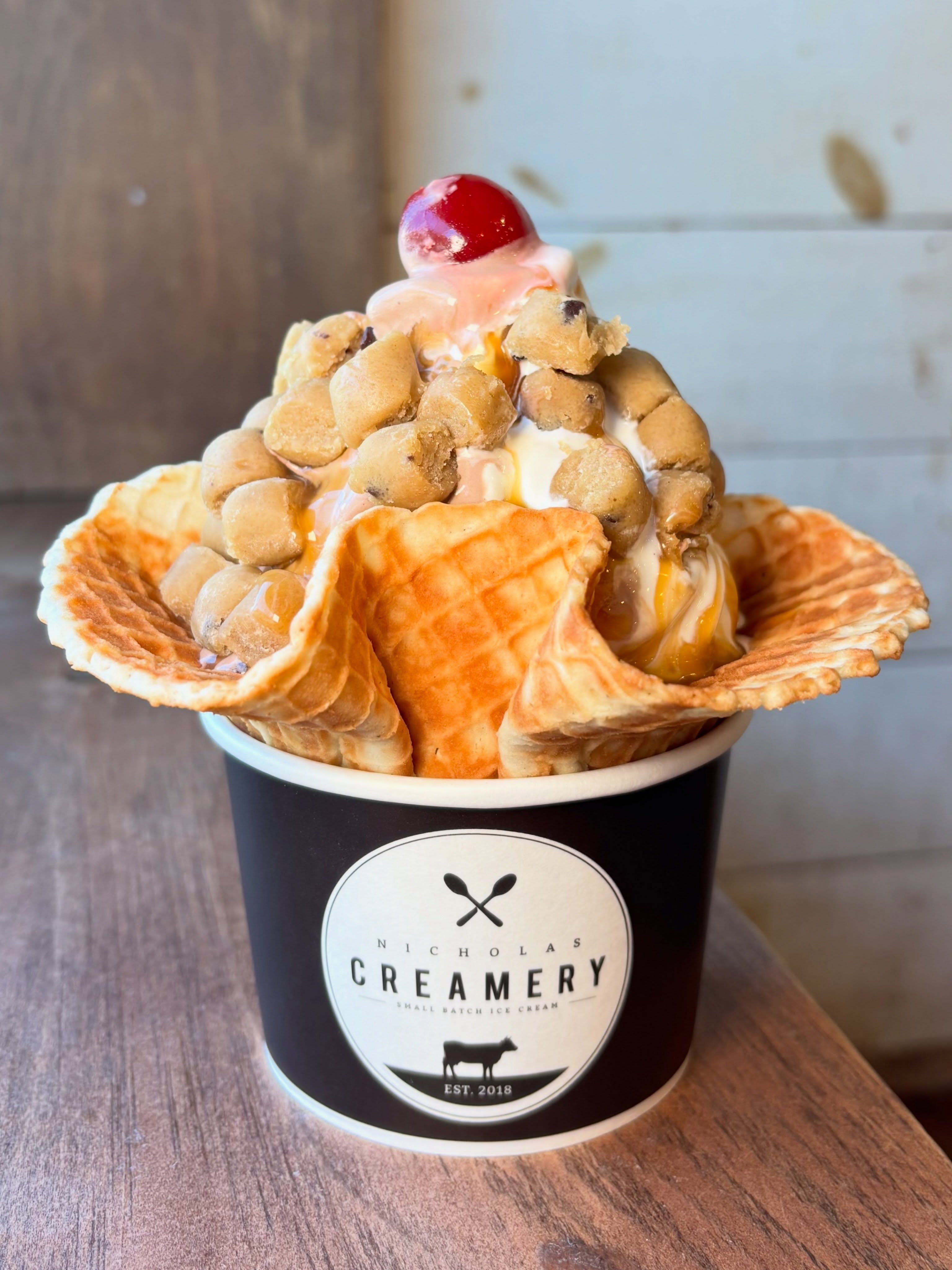 Cookie dough-n’t ya want some? 😏🍪 Because a scoop of homemade ice cream is great, but homemade scoops absolutely LOADED with cookie dough? Now we’re talking.
Pile it high and drizzle it up in North Brunswick, Wall, Middletown, Long Branch, Tinton Falls, Fair Haven, and Atlantic Highlands!
#nicholascreamery #icecreamsundae #cookiedough
