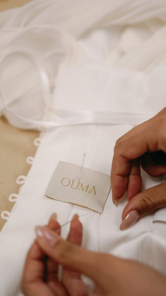 Every detail matters.
Every fold, every stitch, every curve is part of the story.
Nothing is accidental — the details are what give a piece its soul, its movement, its meaning. From the first sketch to the final stitch, each one is made to be felt.
Because the most beautiful stories are often told in the smallest details.
#OUMA #MadeInVancouver #BridalCouture #ModernBride #CoutureBridal
Cover photo by @beigeweddings