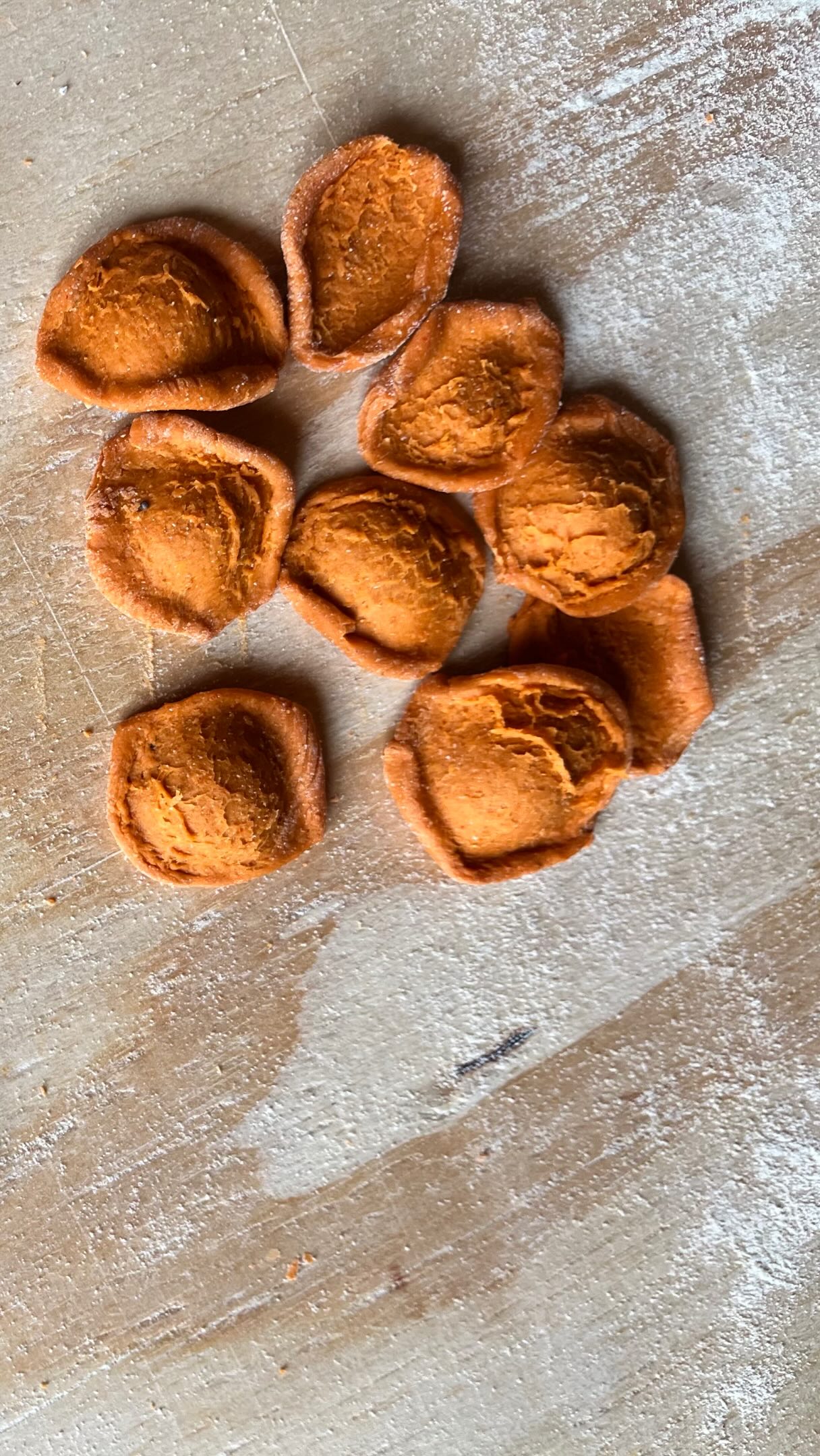 Dough recipe below, for shaping orecchiette with a simple butter knife. The technique is so subtle, and takes some practice to achieve the beautiful cracks and tears on the outside of the orecchiette that make this pasta shape so special and delicious. Orecchiette are the specialty of Puglia (the heel of the boot that is Italy). I really want to go there one day and see the famous nonnas sitting on the streets and cracking these out at top speed. Until then, I’ll just be happily making my own, it’s a wonderful meditation.
Semolina dough (per person):
100g semolina flour
50g lukewarm water
Optional: tablespoon of mild paprika powder for the red color
Technique:
Make a well in the semolina flour, add the water and then start scrambling it with a fork until it becomes custardy in texture, then start incorporating the remaining semolina flour and ultimately start kneading until you get a smooth pasta dough. Let it rest for at least half an hour and then roll it out into a strand, cut off thumbnail-sized pieces and drag those over a flat surface with a butter knife. Then gently use your fingertips to flip the shape inside out.
#orecchiette #pastamaking #pastafresca #homemadepasta #semolinadough