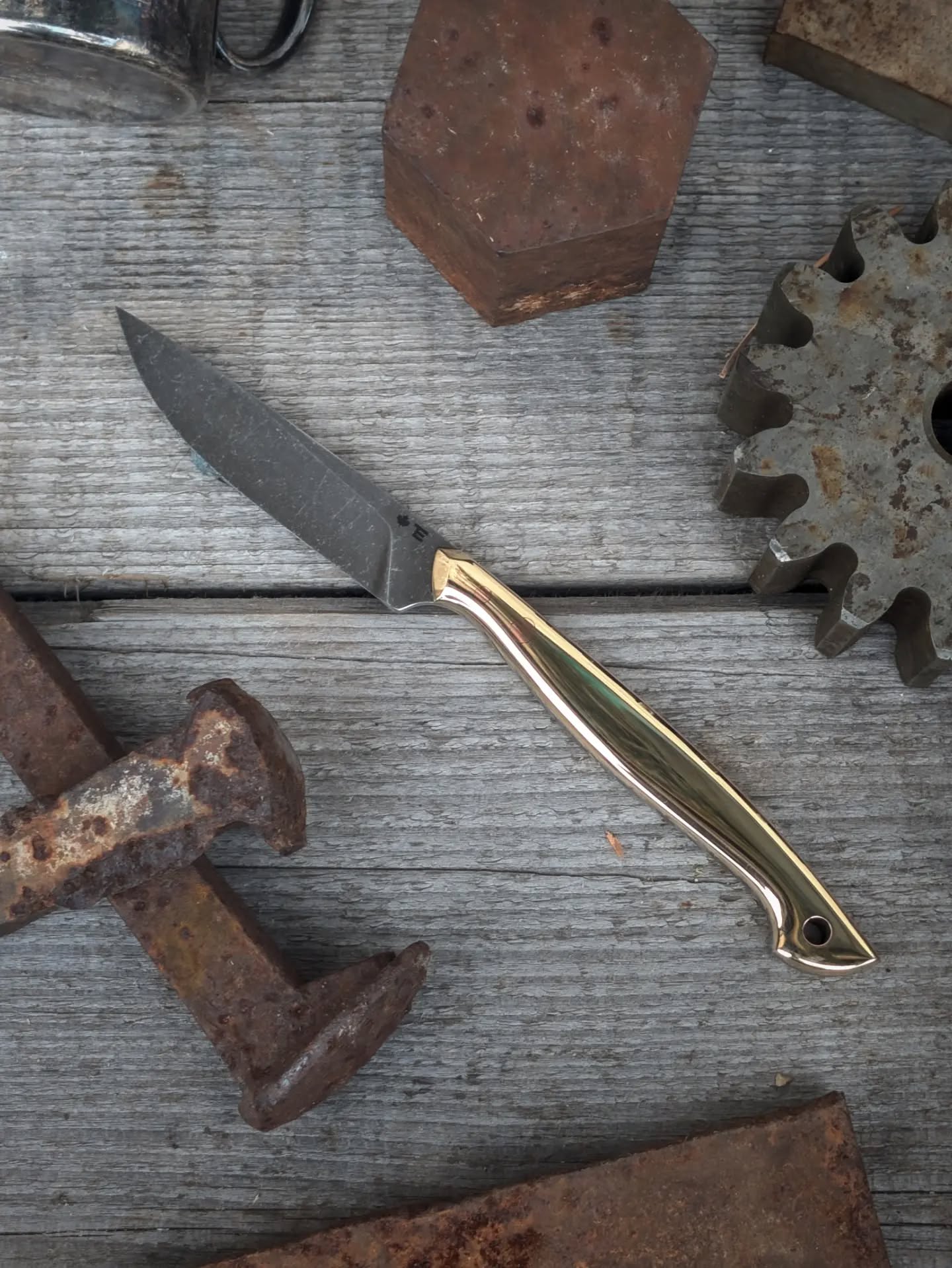 The perfect edc, cutlery tool, or small game cleaner. High roller? Classy? Or just like a touch of bling, this is the perfect piece. Slim, nimble, and agile the Needle that will cut your boxes, clean a grouse, or be used as a steak knife during your trips to the 5-star restaurants.
One thing I'm really looking forward to is the difference in patina on the copper pins and brass scales. I was considering doing brass hardware along with brass scales, but I decided that the contrast after aging will look fantastic.
Just because it's made for use doesn't mean it can't be beautiful.
Statistics.
Style: Needle
Steel: CPM Cruwear
HRc: ≈62.5
Overall length: 7.25"
Blade length: 3"
Cutting edge: 2.75"
Stock: 3/32"
Handle: Brass
Pins: Copper
Tube: Copper
As always, every step from profiling, to heat treat, to polishing, to leather work is all done myself in Northern BC, Canada.