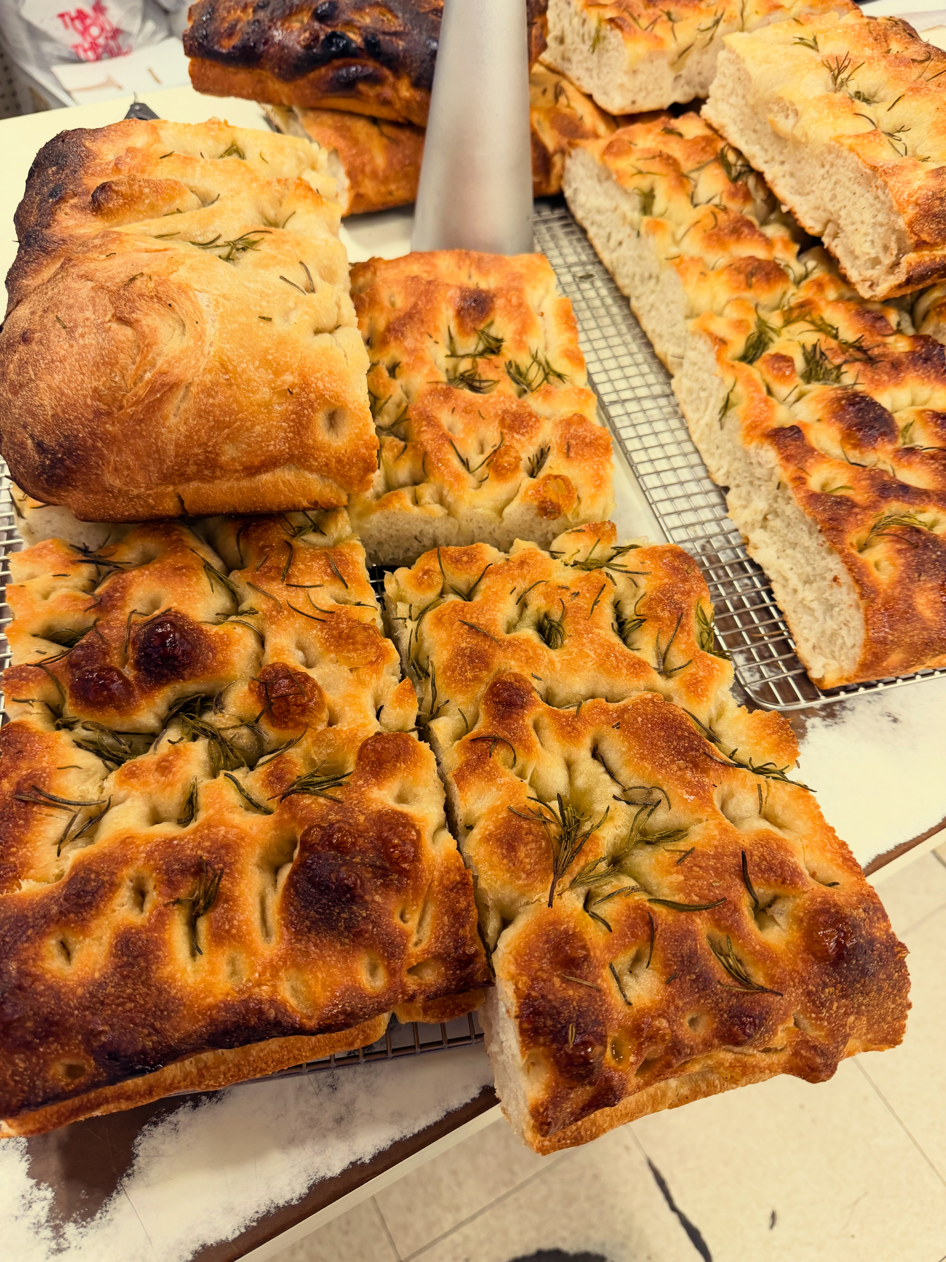 Fresh sourdough focaccia, hot out of the oven! 🍞🌿 Golden and crispy on the outside, soft and fluffy inside, and topped with rosemary. Stop by The Oxford Market and grab some while it’s warm!