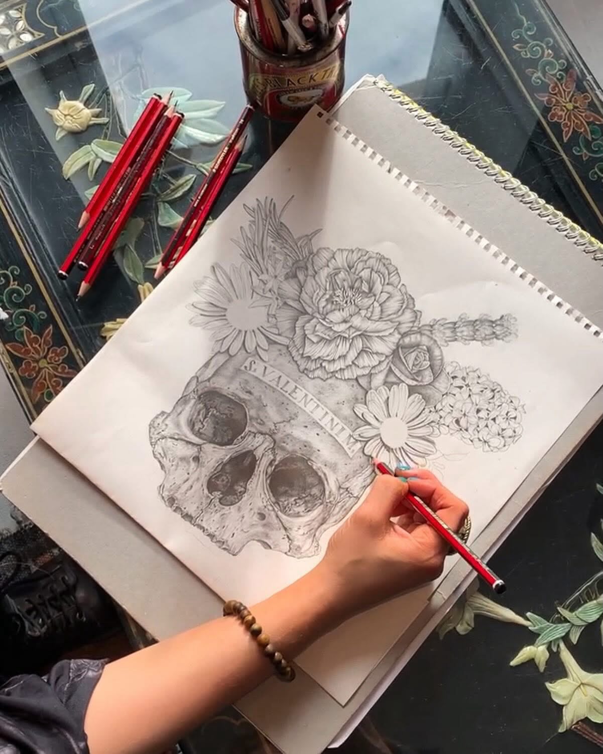 From pencil and paper to an ever-growing collection. There’s something really special about looking back at that first sketch and seeing just how far it’s travelled
The Valentine has evolved across prints, jackets, dresses, bags and more. Each new piece gives the original artwork another life.
And the collection keeps growing… 💀