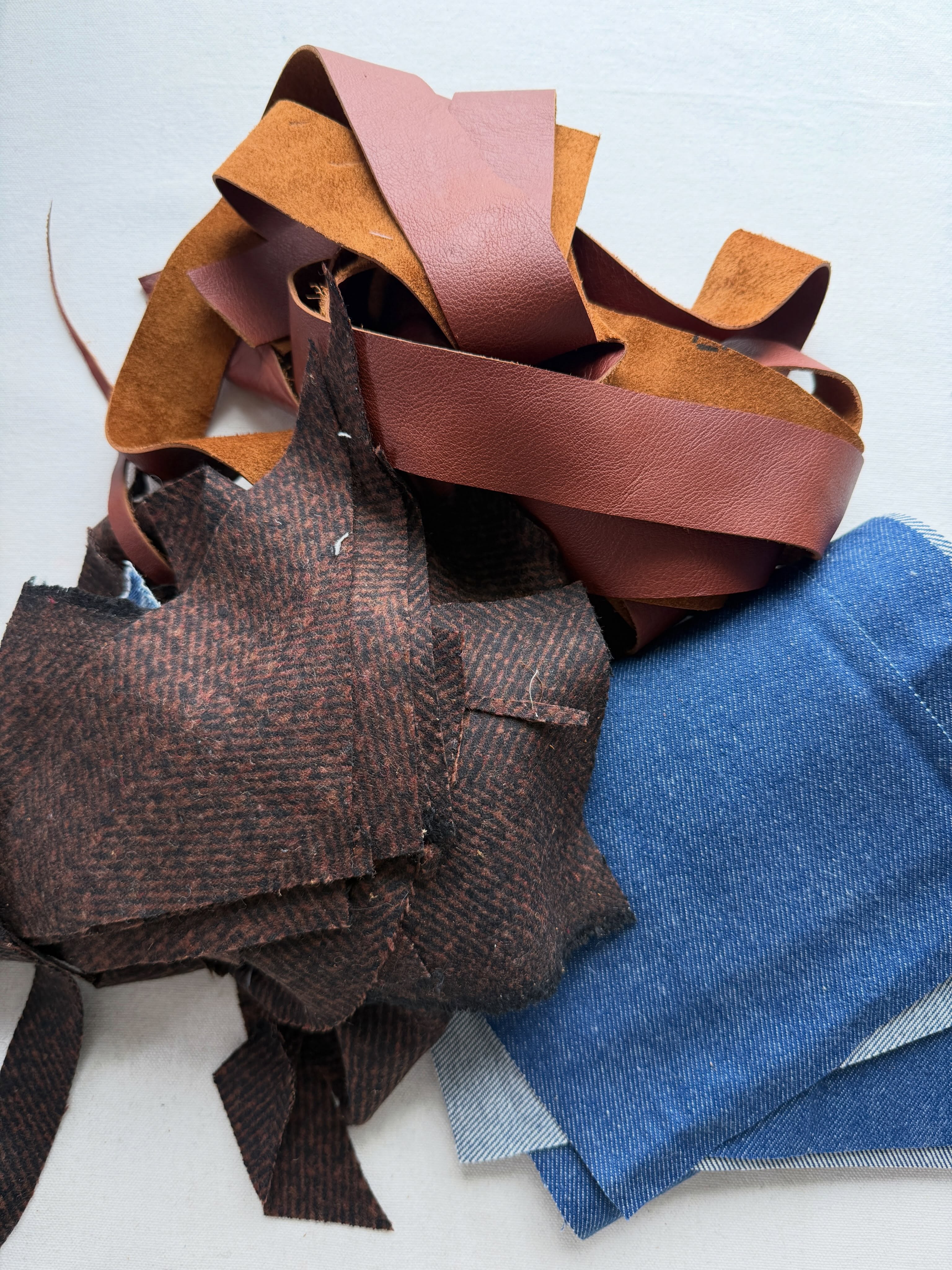 Week 1 of the Tote-along (Totepack + Sewalong) was all about choosing your materials, which meant I actually had to make a decision. And I finally did! I knew I wanted to use leather, but what kind and how?
I ended up choosing two large(ish) pieces I found at SCRAP and pairing them with some very blue denim (not from jeans but from a roll of denim I found at SCRAP) and then I grabbed this gorgeous silk/wool herringbone that I found at… that’s right, SCRAP. I think the herringbone was donated by the awesome @christinehaynes - the leftovers from a project. Rather than using strap webbing I decided I’m making my own straps out of leather.
Week 2 starts Sunday and I’m supposed to be a week ahead of everyone so I’ve also been working on prepping and quilting the bag body. In a shocking turn of events, I’m not exactly following my own pattern…
It’s not too late to join the Tote-along! All the details are on the Totepack Resource page that you get access to once you buy the pattern ☺️.