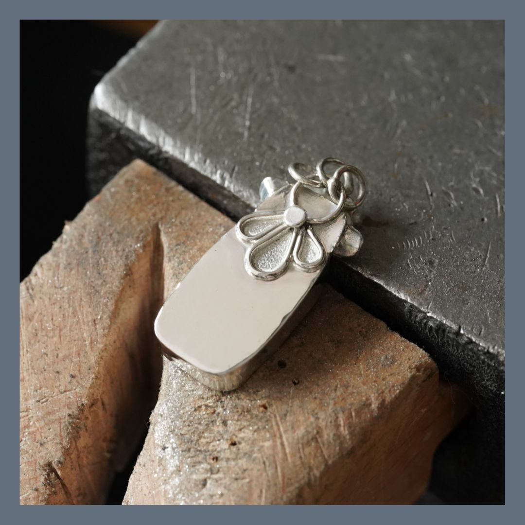 I love tiny details and these are often what makes handmade jewellery so special.
I’ve added a little flower pattern to the back of this pendant. It’s not really there for anyone else to see, it’s just a little something special for the person wearing it.
I think that’s one of the lovely things about handmade jewellery. It gives me the chance to add those little details that are not immediately obvious and make a piece feel that bit more personal.