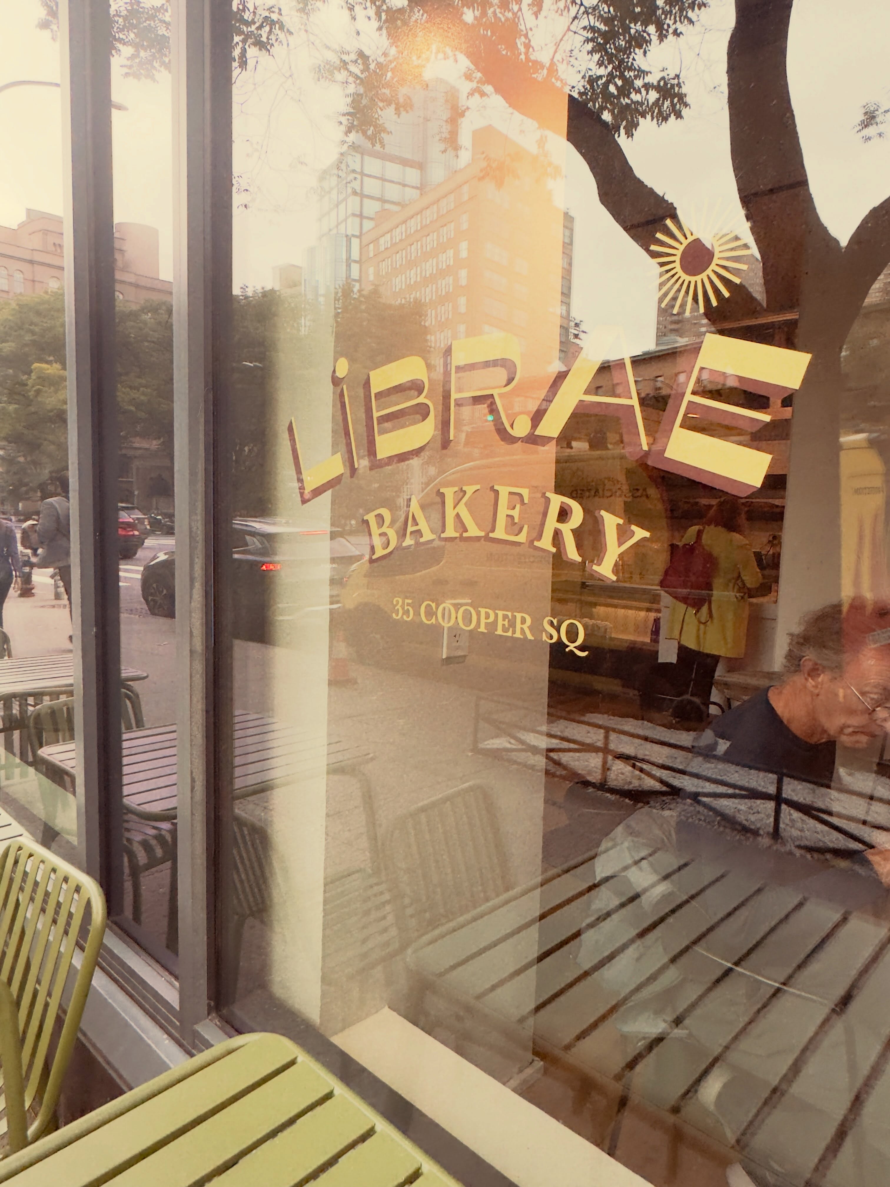 The smells emanating from this bakery on the lower east side enveloped me and drew me in. Librae describes itself as a third culture bakery and displays the flags of Denmark, Bahrain and the United States. Their baked goods and the smells are incredible pistachio, cardamom, cinnamon, rich with butter along excellent coffee. The bakery itself is visible in the background through glass doors and to the right in one of my photographs you’ll see what’s described as the disco croissant it’s self-explanatory. I definitely recommend this place and will be returning for more treats. #bakerylife #eastvillagenyc #proustianmemories #libraebakery