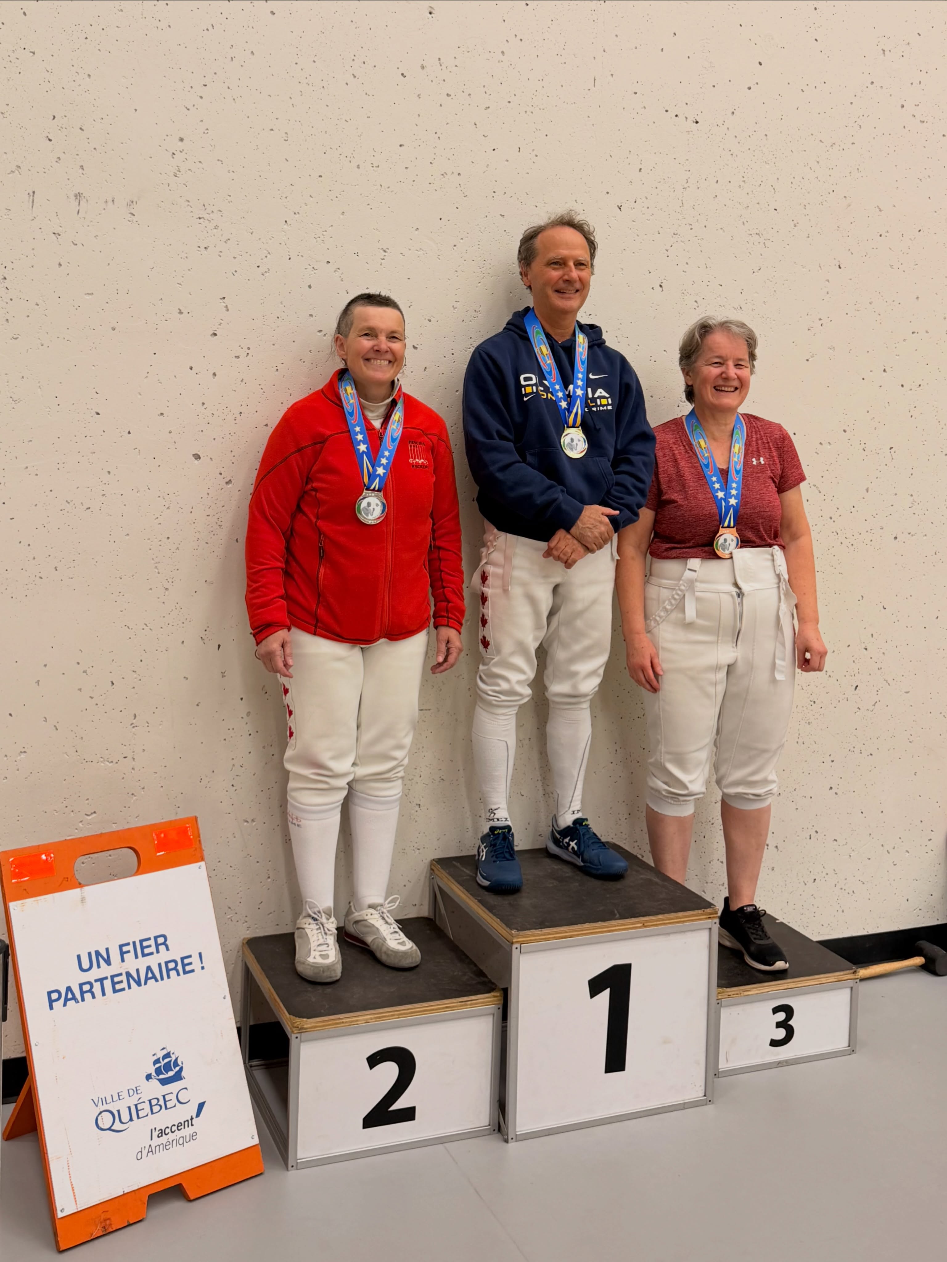 The season is underway. ⚔️
Last weekend EMR competed at the provincial tournament and it is good to be back. The club has been lively, the energy is high and EMR is ready to take on the year ahead.
A wonderful day on the piste with some standout performances worth celebrating.
🏆 TOP RESULTS
Prune Huguet
🥇 Gold — Women’s Foil AAA
🥉 Bronze — Mixed Foil AAA
Siobhan Moss
🥈 Silver — Vet-60 Mixed Foil
🥈 Silver — Vet-60 Women’s Épée
🥉 Bronze — Vet-60 Mixed Sabre
🥉 Bronze — Vet Mixed Foil
5th — Vet Mixed Sabre
7th — Vet Women’s Épée
Siobhan continues to be a force across multiple events and weapons. Remarkable as always. 🤺
Adrian Hin Cheong
5th — AAA Men’s Sabre
A special mention for Adrian who achieved this result at his very first sabre tournament.
Alban Delarue
27th — Men’s Épée Senior
Dmitry Mikhaylov
14th - Men Epee AAA
Well done to everyone who competed!
- - - - -
La saison est lancée. ⚔️
Le weekend dernier, EMR participait au tournoi provincial et quel plaisir d’être de retour. Le club est animé, l’énergie est au rendez-vous et EMR est prêt à prendre d’assaut l’année à venir.
Une belle journée sur la piste avec des performances remarquables à souligner.
🏆 MEILLEURS RÉSULTATS
Prune Huguet
🥇 Or — Fleuret femmes AAA
🥉 Bronze — Fleuret mixte AAA
Siobhan Moss
🥈 Argent — Fleuret mixte Vét-60
🥈 Argent — Épée femmes Vét-60
🥉 Bronze — Sabre mixte Vét-60
🥉 Bronze — Fleuret mixte Vét
5e — Sabre mixte Vét
7e — Épée femmes Vét
Siobhan continue de s’imposer dans plusieurs épreuves et plusieurs armes. Remarquable comme toujours. 🤺
Adrian Hin Cheong
5e — Sabre hommes AAA
Une mention spéciale pour Adrian qui a obtenu ce résultat lors de son tout premier tournoi de sabre.
Alban Delarue
27e — Épée hommes Senior
Dmitry Mikhaylov
14th - Epee Hommes AAA
Bravo à tous ceux qui ont compétitionné!