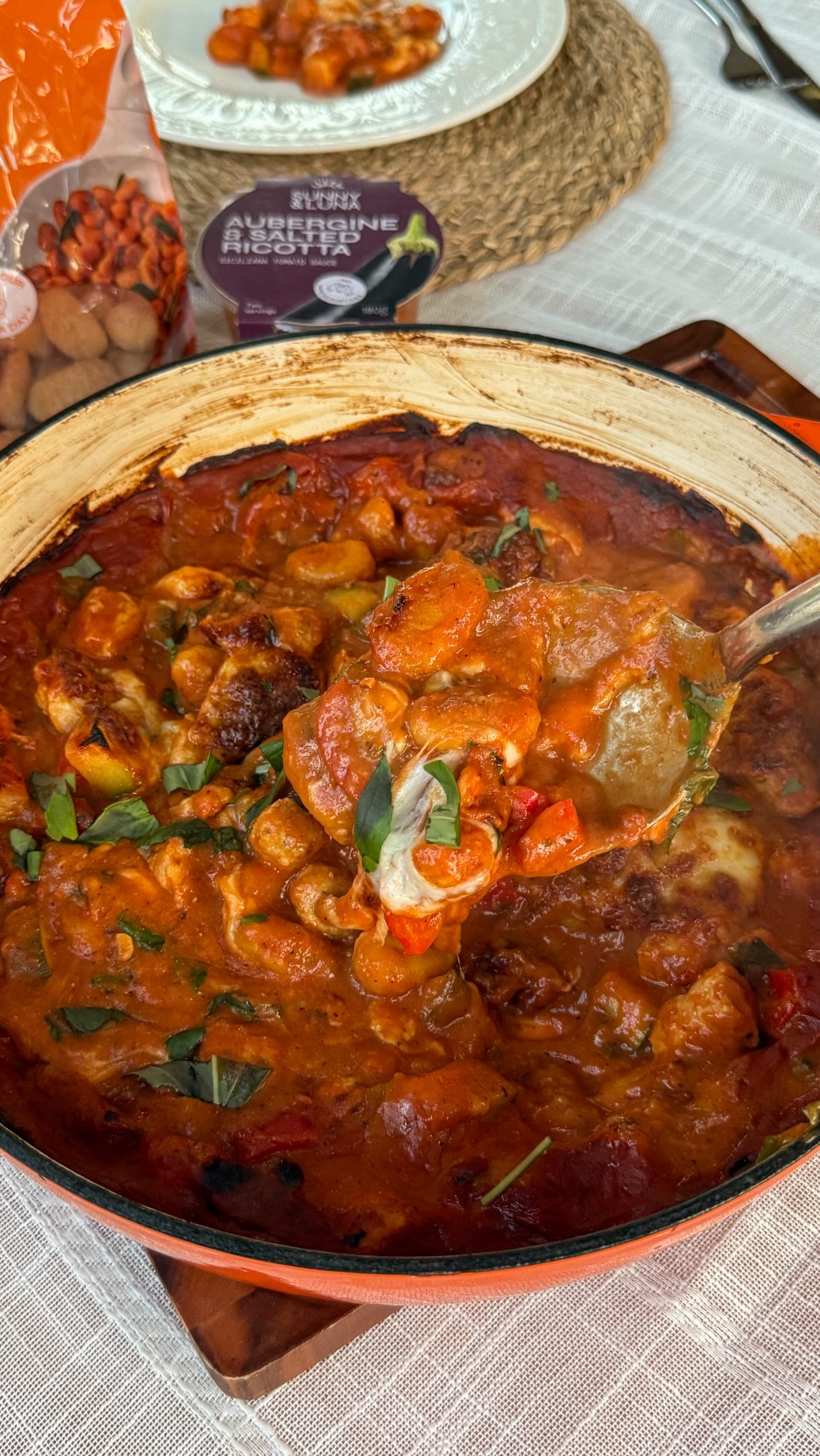 Introducing our new series: One Pan Gnocchi. 🍝
Hearty, feel-good dinners to see you through autumn, all made in one pan.
For our first episode, we’ve made a Sausage, Aubergine & Ricotta Gnocchi Bake. It’s packed full of veggies, and our Aubergine & Salted Ricotta Sauce is the secret weapon for that rich, slow-simmered taste without hours on the hob.
Sausage, Aubergine & Ricotta Gnocchi Bake
Serves 2-3 | 40 minutes
You’ll need:
🍅 1 pack Sunny & Luna Pumpkin Gnocchi
🍅 1 tub Sunny & Luna Aubergine & Salted Ricotta Tomato Sauce
🍅 6-8 sausages - we used @heckfooduk chicken chipolatas (you could sub for veggie too!)
🍅 1 courgette, chopped
🍅 1 red pepper, chopped
🍅 2 garlic cloves, chopped
🍅 1 tbsp tomato purée
🍅 A pinch of chilli flakes
🍅 1 chicken stock cube
🍅 500g passata
🍅 200ml water
🍅 1 tbsp balsamic vinegar
🍅 1 heaped tbsp crème fraîche
🍅 ball mozzarella
🍅 Oil, salt and pepper
Method:
👉 Preheat the oven to 210°C. Remove the sausage skins, break the meat into small pieces, cook through & brown in an ovenproof pan with a little oil. Set aside.
👉 Add the courgette, pepper and garlic to the same pan. Cook for around 8 minutes until softened, then add the gnocchi and cook for a few minutes more.
👉 Stir in the tomato purée and Aubergine & Salted Ricotta Sauce for a minute. Add the passata, chilli flakes, stock cube and water, then simmer for 10 minutes.
👉 Return the sausages to the pan with the balsamic vinegar. Season with salt and pepper and stir for a few minutes until heated through.
👉 Turn off the heat and stir in the crème fraiche. Tear the mozzarella over the top and bake for 10-12 minutes, until golden and bubbling.
Save this for your next cosy night in! 🧡