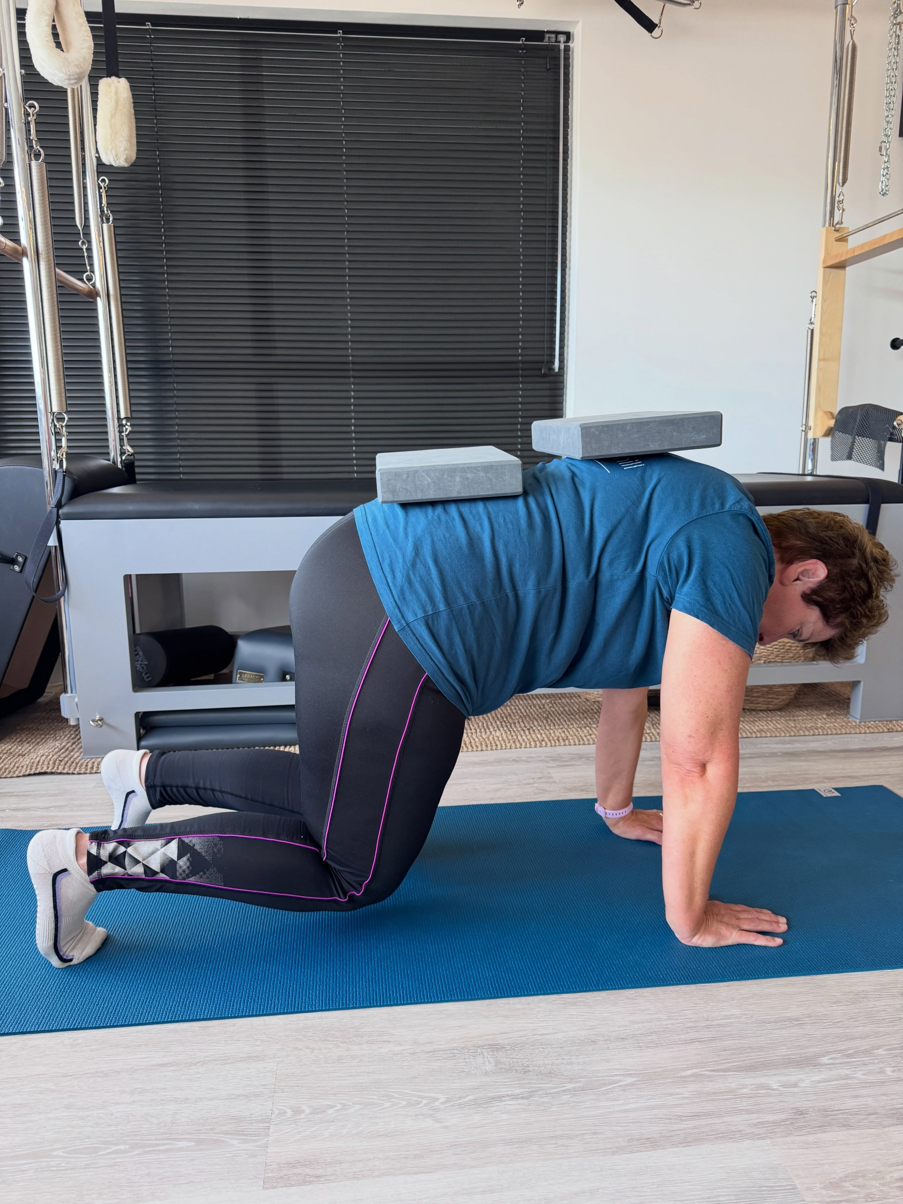 THIS IS PILATES: PRACTICE, NOT PERFECTION ❤️
Yes, there is a reason she’s got two blocks balanced on her back! 😂
Some days everything just seems to work.
Your balance is there, your body does what you’re asking it to do and you think…
“Ooh, I’m actually getting quite good at this!” 😂
Then the next week you wobble, forget which leg you’re supposed to be using and an exercise you’ve done loads of times suddenly feels impossible.
Welcome to Pilates! 😂
Because Pilates isn’t about doing everything perfectly.
It’s about practice.
Repeating things.
Getting to know how your body moves.
Finding a little more control.
Getting a little stronger.
And gradually noticing that the things you once found really difficult… aren’t quite so difficult anymore.
Sometimes I’ll make an exercise harder.
Sometimes I’ll change it to work better for you.
And sometimes I’ll take you right back to basics because that’s exactly what you need that day.
Whether we’re working on the Mat or the apparatus, nobody gets a prize for doing the fanciest version of an exercise.
And yes, sometimes Pilates involves balancing blocks on your back so you can actually feel what your body is doing! 😄
Practice, not perfection.
That’s Pilates. ❤️
Steph
x