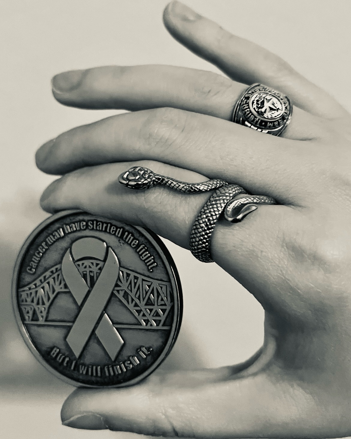 When people compliment my rings, I feel proud, but they might never know why.
My university ring makes sense because people are familiar with them. But for me, it’s a reminder of mi familia. Mi abuelo had an Aggie ring, mi papi has one, and mi tío has one. While I’m not an Aggie, as an Islander I’m part of the Texas A&M system.
As a Greek Latina, mi familia has always supported my education all the way to my Masters degree. Seeing that ring reminds me of what I’ve accomplished and continue to do so with my degrees. I’ve worn that ring for the awhile. Now I have another one.
The snake ring has references to @taylorswift’s Reputation album and @t22felton, but it mostly represents my fight against Lymphoma, a Blood Cancer, and getting through it. The skin shedding represents healing, renewal, and personal transformation. I feel like the snake represents my life in remission from Lymphoma.
I wanted to have something that I could have with me that was visible all the time. The coin was something I received, but it’s not something that I can take with me like a ring. But I am thankful for the coin as a reminder too that I went through treatments in Corpus Christi, Texas and continue to survive here.
September is Blood Cancer Awareness Month. So I’ve been using this month as a way to reflect on my Blood Cancer survivorship journey, and how it has impacted my writing career. When I was diagnosed, I was wrapping up my second fiction book NEVER FORGET.
I wrote my poetry book DIVE WITHIN during cancer treatments and recovery to help me heal. Then after that I wrote another poetry book PONDERING REFLECTIONS that led me to reflect on the past to help me move forward in remission.
After three years in remission from Lymphoma, while I’m grateful, I still feel the impacts and I know I still will for the rest of my life. But I’ll keep writing and making visual art, no matter my busy schedule or my health challenges, because it not only helps me, but helps you too with what you’re dealing with and find a way forward, not feeling alone.
Don’t forget to support @bloodcancerunited this month and year around to help those who are impacted by Blood Cancers.