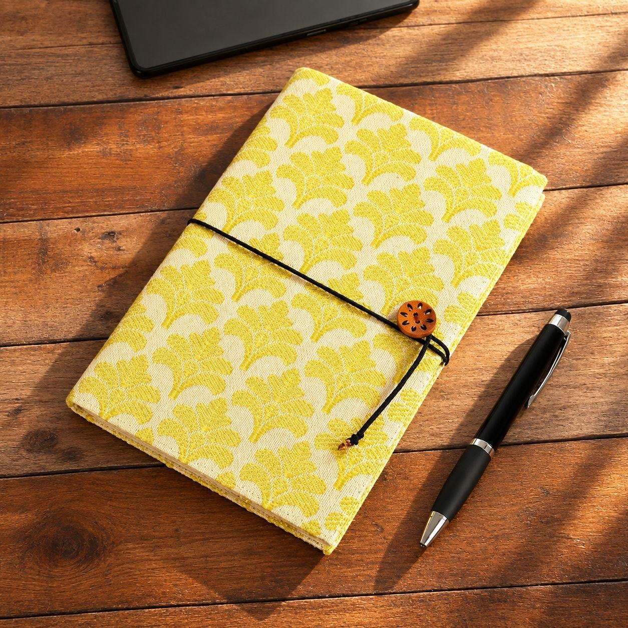 Start your morning with our Positivity Himroo Journal. Inspiration comes in an A5 size notebook with a beautiful #Himroo cover handwoven in pure cotton and silk. The vibrant daffodil motif invokes sunny days and morning motivation! Handloomed goodness, finished with a charming wooden button and dori closure. #journaling #journals #poetry