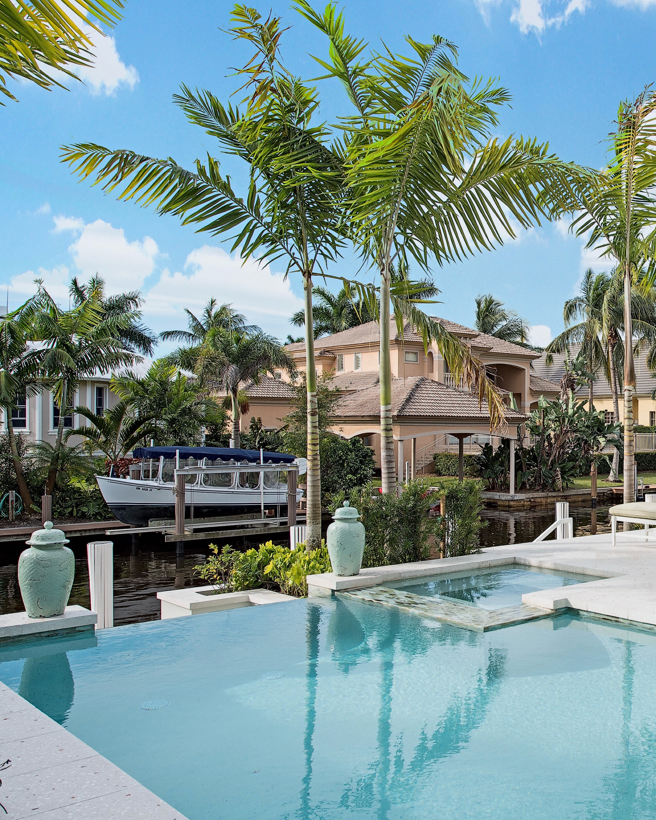 Palm Key Retreat is all about the ease of waterfront living. Framed by palms and softened with cool coastal tones, the pool terrace flows effortlessly toward the canal, creating a setting that feels relaxed, refined, and unmistakably Naples.
From the water’s edge to the shaded outdoor living spaces, every element was designed to make the landscape feel like a natural extension of the home.
#PalmKeyRetreat #NaplesLandscapeDesign #WaterfrontLiving #LuxuryLandscapeDesign #OutsideProductions