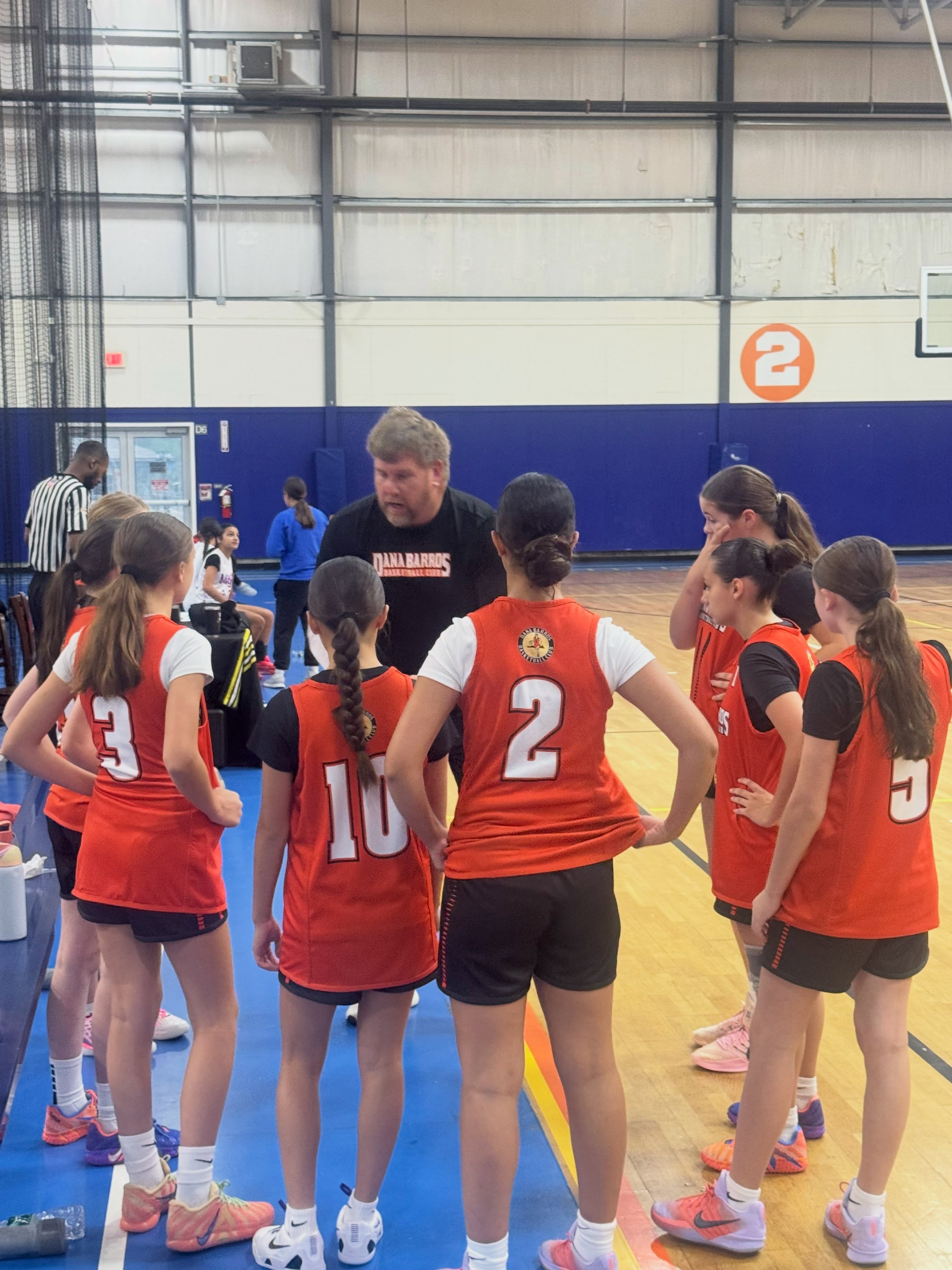 Coach Ross coaching hard in the huddle!