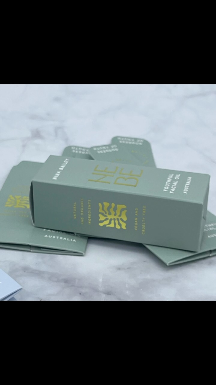 Luxe gold foil and embossed facial oil boxes for @ninabaileyau
