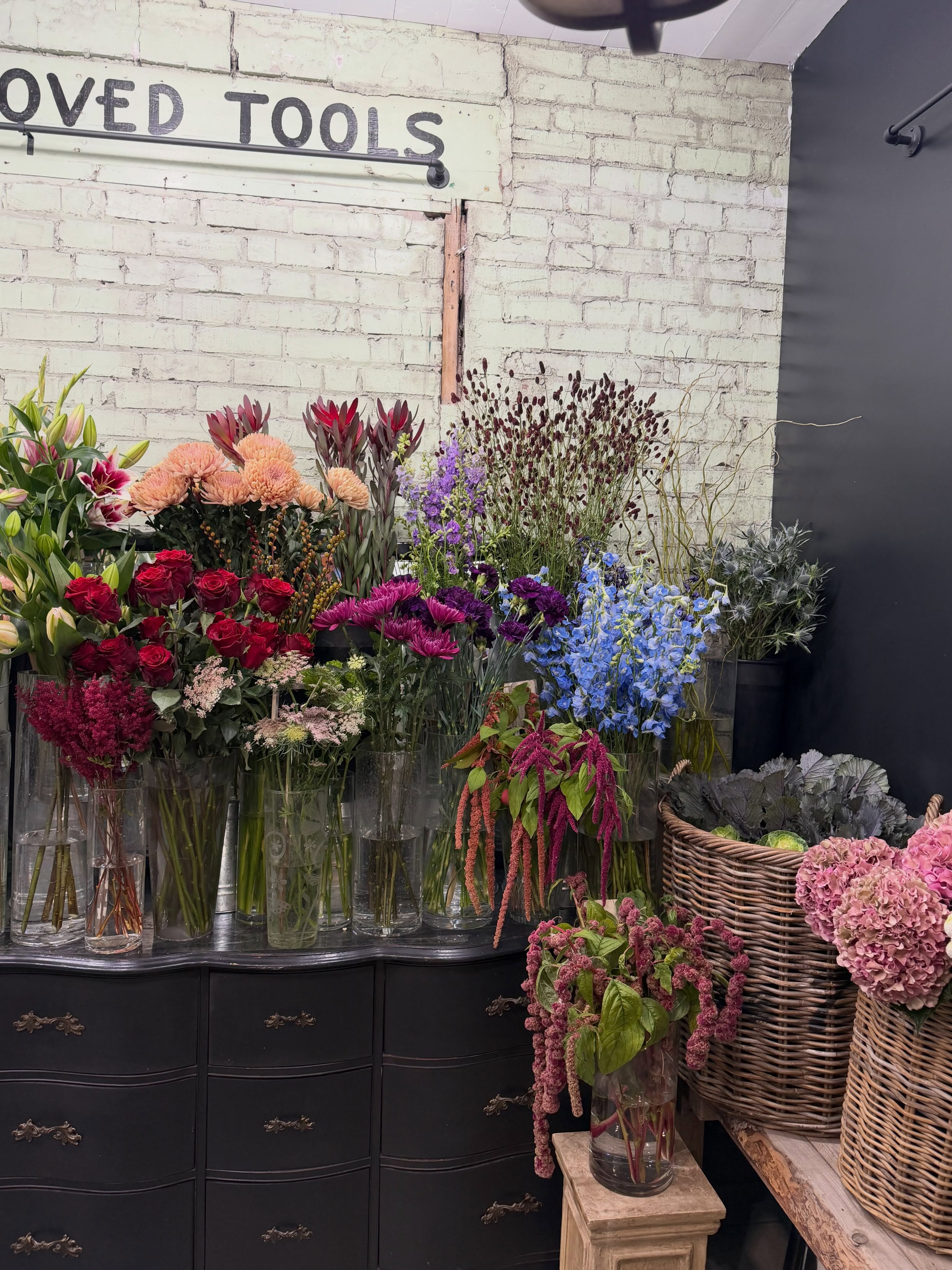 🌿 A little cooler reminder from Dutchess 🌿
We want our walk in flower cooler to be a welcoming, inspiring space where you can browse and find something beautiful for all of life’s occasions. Lately, however, we’ve noticed a trend of individual flowers being handled roughly, and sometimes picked directly from our arrangements and vases without assistance.
We kindly ask that you need to let a staff member assist you with loose stems. Our flowers are delicate and many are specialty, high-end blooms. Once stems are broken or flowers are damaged, we can no longer sell them — which unfortunately becomes a loss for our small business.
Looking for a custom bouquet or hand-tied arrangement? We are happy to create one with you! 💐 Just let us know what you’re looking for and we’ll help select the flowers and put it together.
Our ready-to-go arrangements can be brought to the till area if you decide on one of those options - or one of our staff members can gladly assist.
We’ve also added a maximum of two customers in the cooler at one time, simply so the space doesn’t become crowded and our flowers and displays can be enjoyed without things getting bumped or damaged.
We truly want Dutchess to be a feel-good place — somewhere you can come in, browse, be inspired and enjoy beautiful flowers and plants. ❤️
So we ask, please respect our space, our staff and our products. We work very hard to bring in beautiful, quality flowers and plants while keeping our prices as reasonable as we can for our customers.
Thank you for understanding, and for helping us take care of Dutchess. 🌿💐