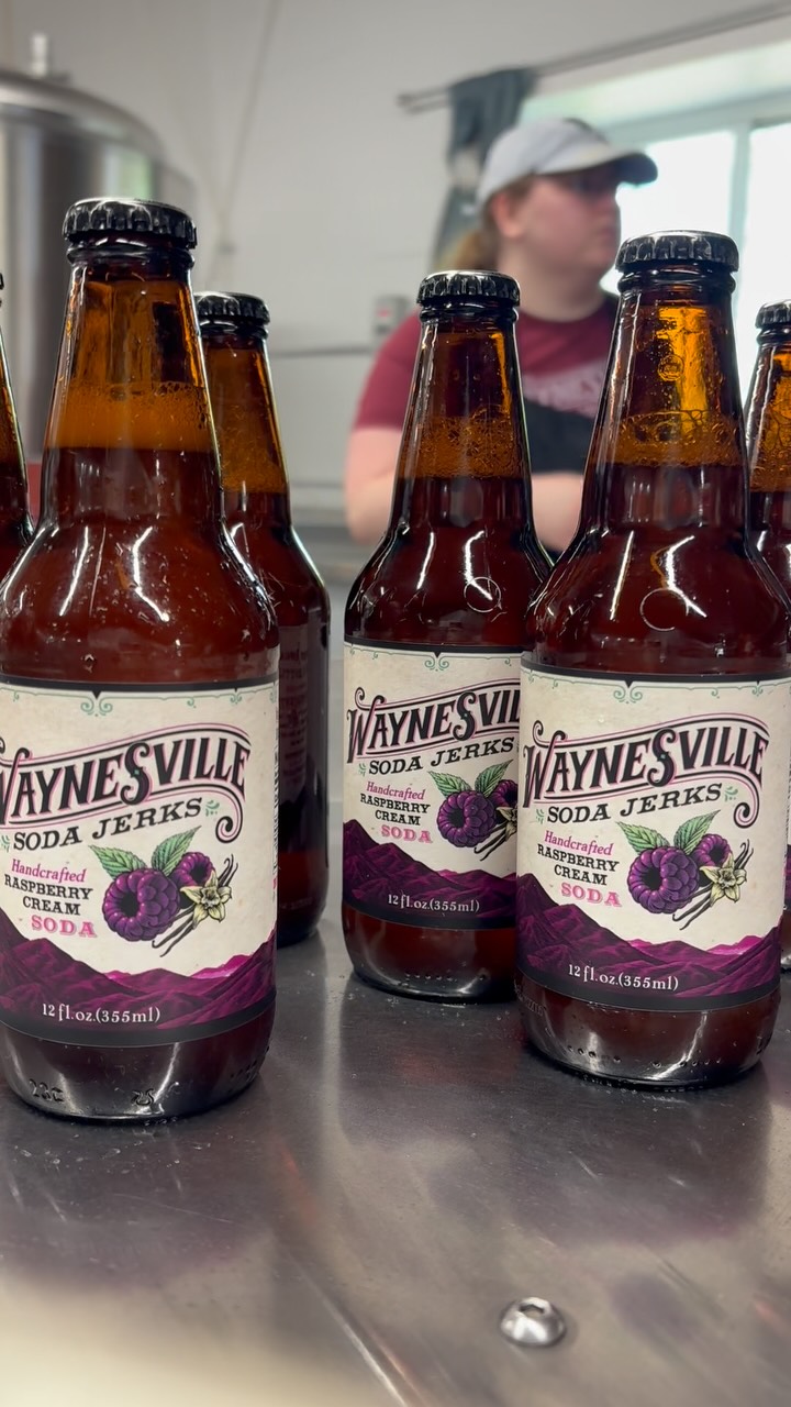 Go for a spin with our Raspberry Cream Soda! 💗🌀
This is our bottle collection table, the final stop in the bottling process before one of our awesome production Jerks packs everything into 24-bottle cases. It’s just one of the many steps that go into making our farm fresh, handcrafted sodas from start to finish, right here at our production facility in Waynesville.
Raspberry Cream is by far our most popular soda flavor, and it’s on draft in the gift shop for you to try! While you’re here, peek through our production doors and catch a glimpse of the soda magic for yourself. ✨
Come see us today through Saturday from 10am–6pm at 35 Bridges St. in Waynesville, NC. 🫧
#waynesvillesodajerks #raspberrycreamsoda #craftsoda #waynesvillenc #shopsmall