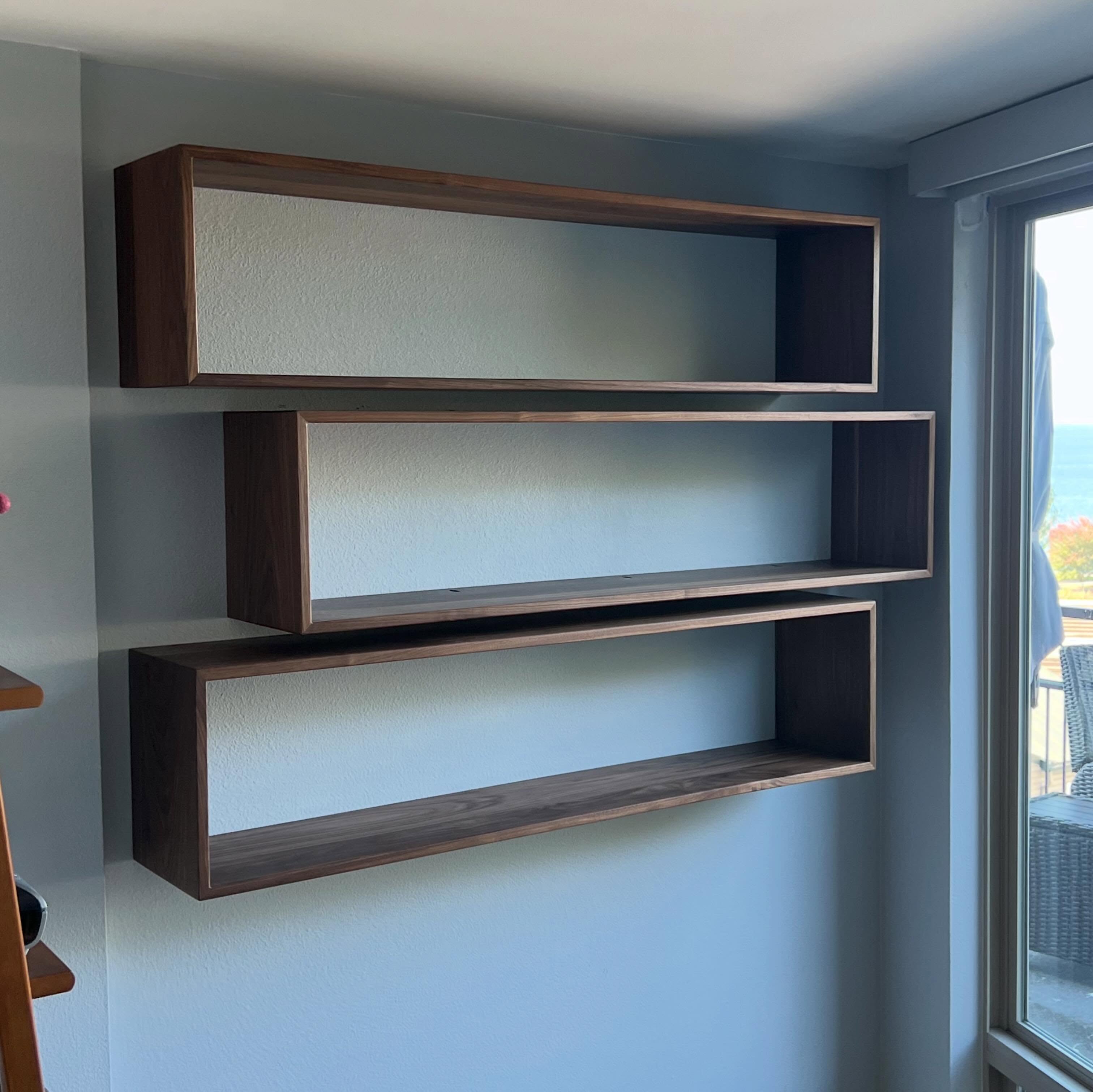 Floating shelves ready for alllll the cookbooks. With a view!