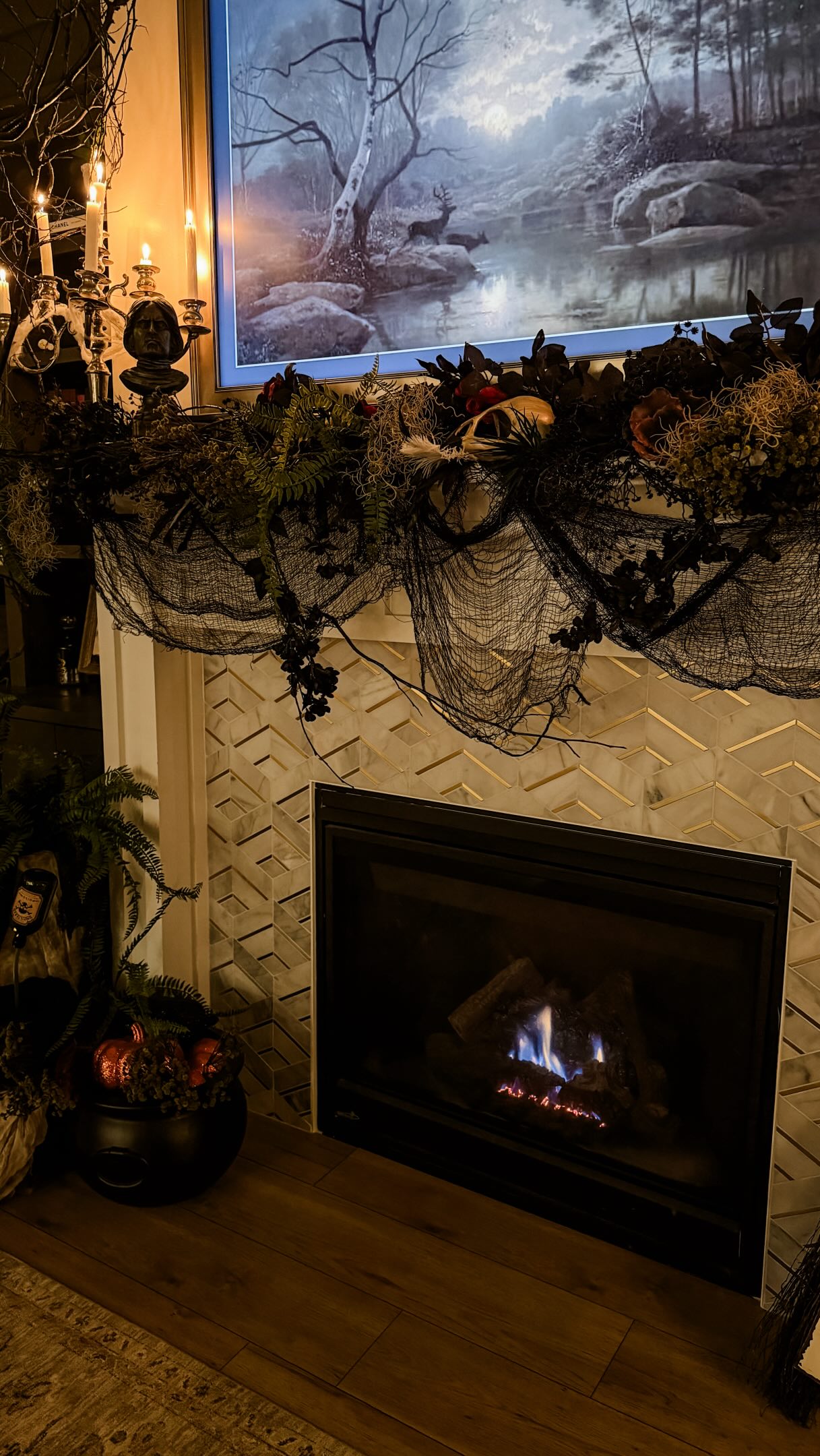 A moodier take on the season.
I transitioned our fall mantel into Halloween with layered greenery, dried florals, candlelight, and a few darker, unexpected details. The finishing touch—a tree foraged from the forest that brought in the organic shape and drama the space needed. #halloweendecorations #halloween #hauntedmansionholiday #halloweendecoration #halloweendecorations