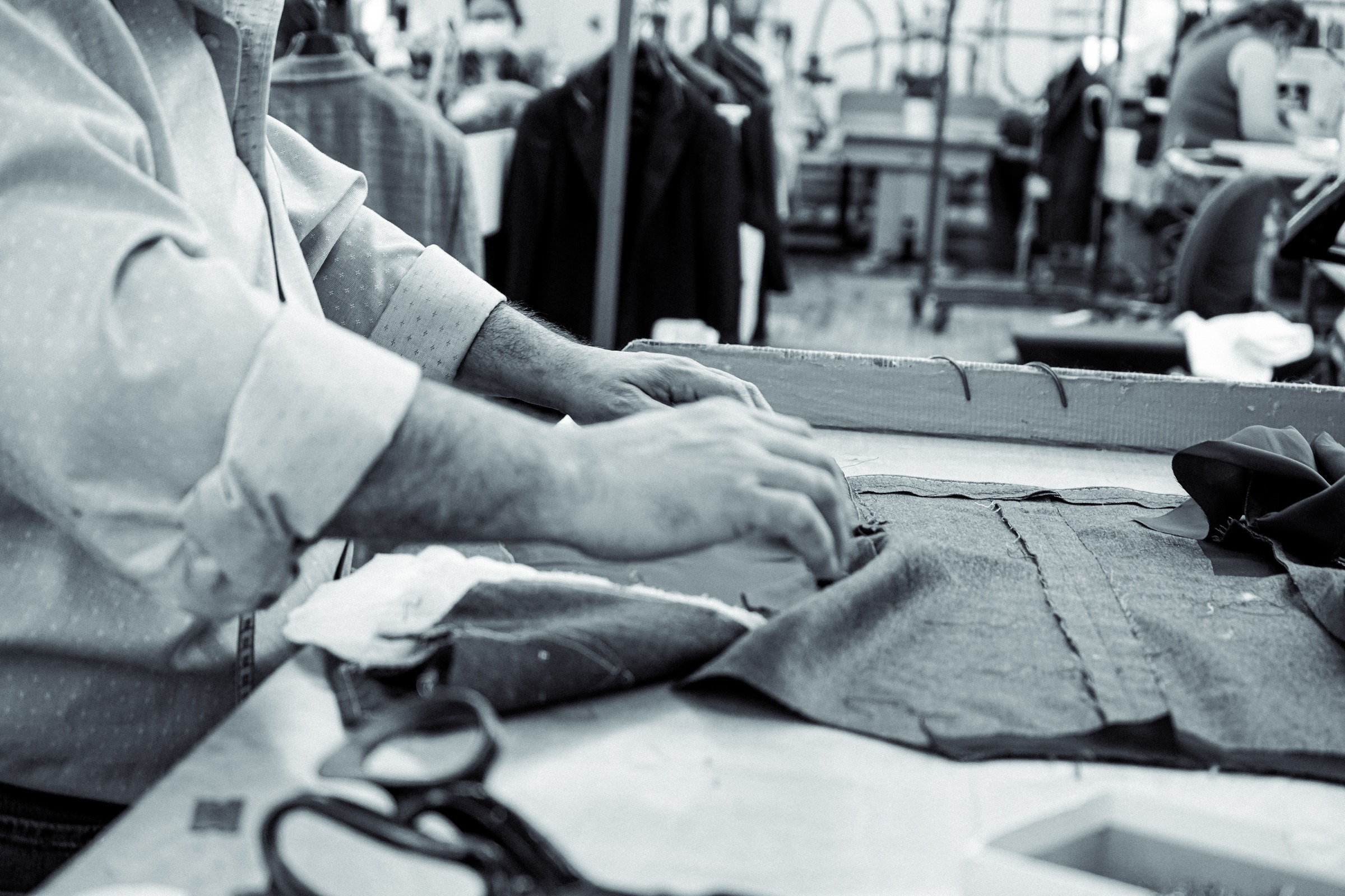 At the worktable in our Rochester shop. #behindthescenes #customclothing #adrianjulesltd
