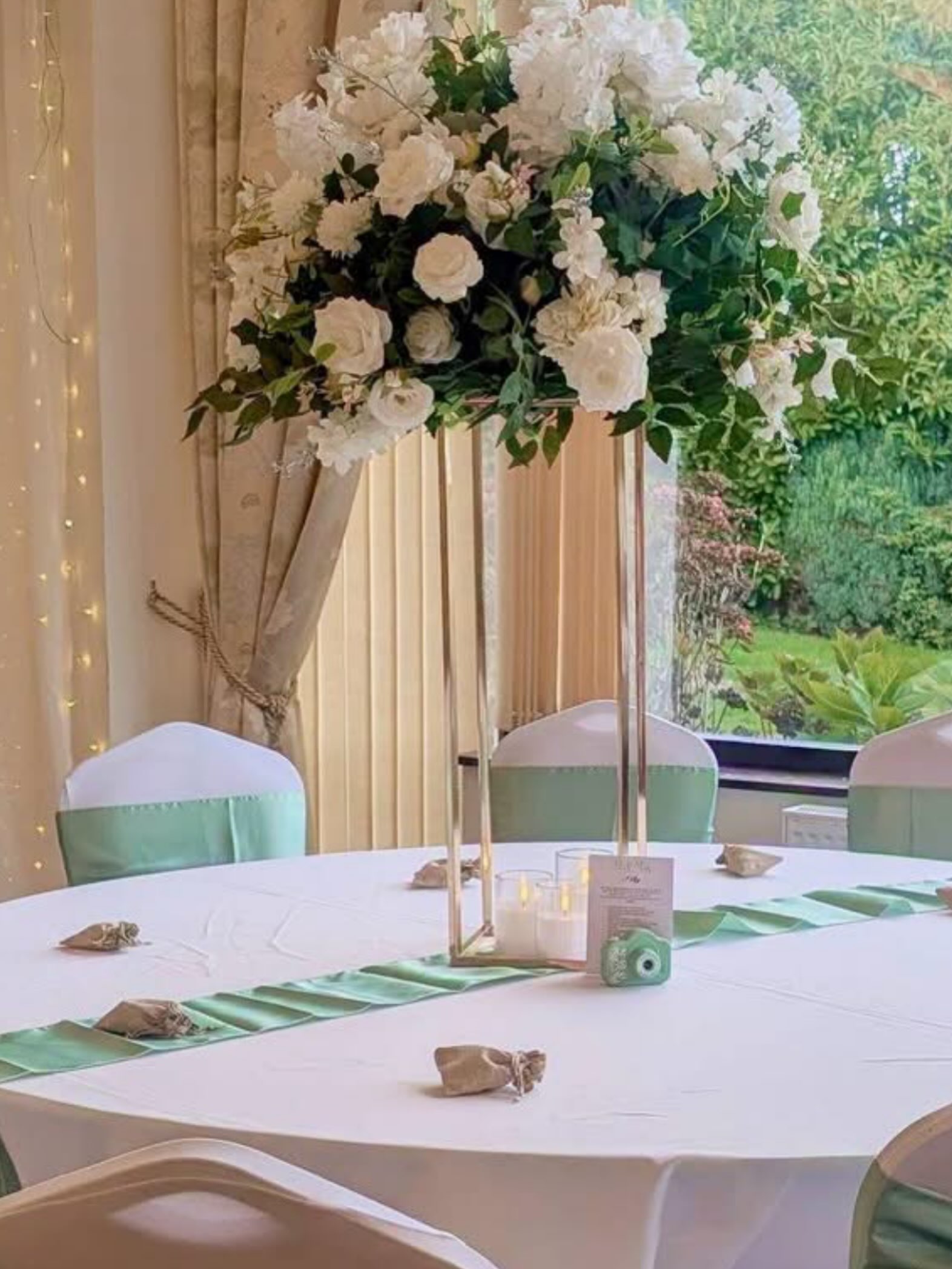 Our stunning green and white flowerballs on gold stands with LED candles for @dannis.flowersandcelebrations 💚🤍