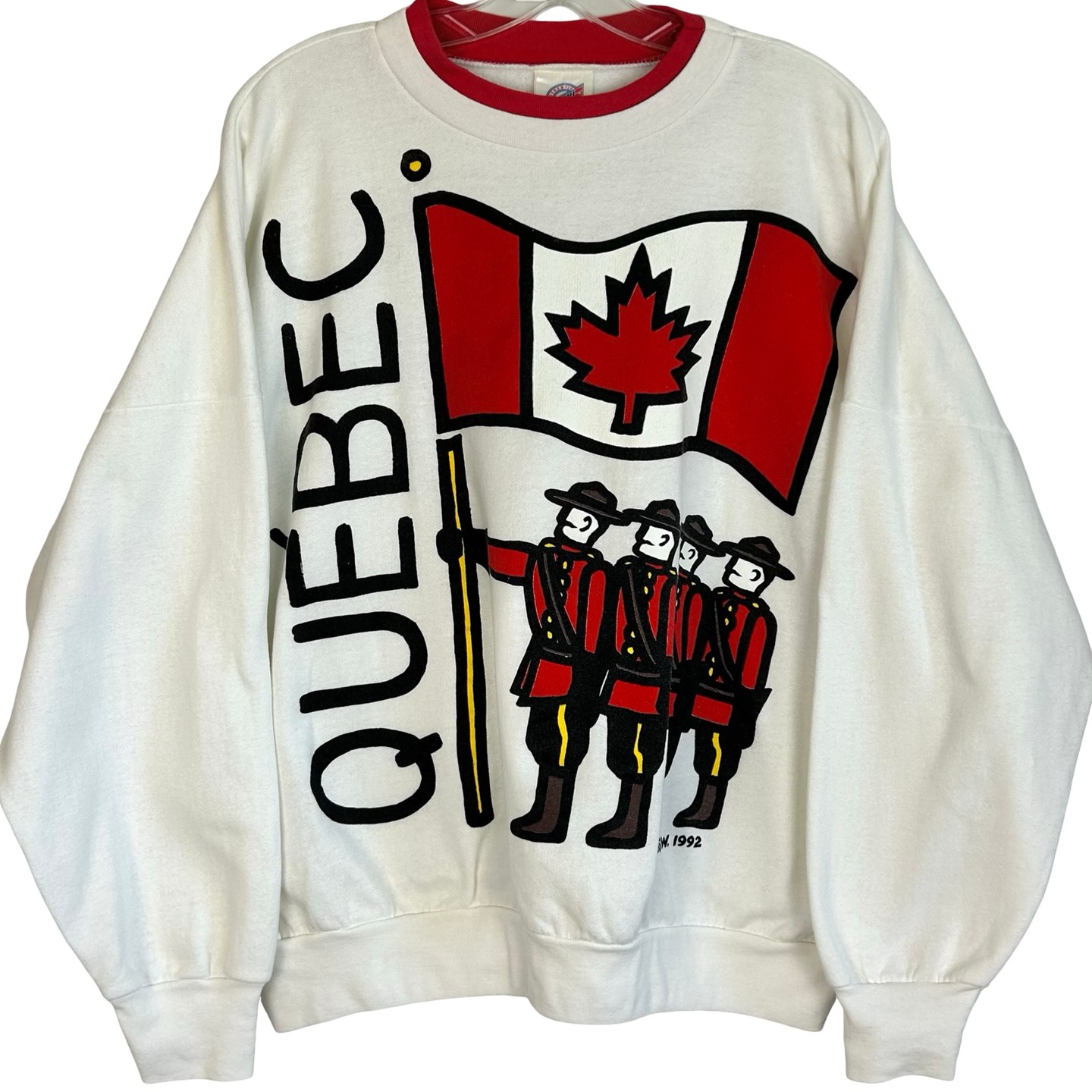 Nostalgic Canadiana energy ✨ Vintage 1992 CGW Quebec crewneck with a bold Mountie pop-art graphic — oversized L, fleece-lined, made in Canada. A rare statement piece for retro wardrobes. Link in Bio #VintageFinds #90sStyle #Canadiana #VintageSweater #Mountie #RetroStreetwear #ThingsVintageCA