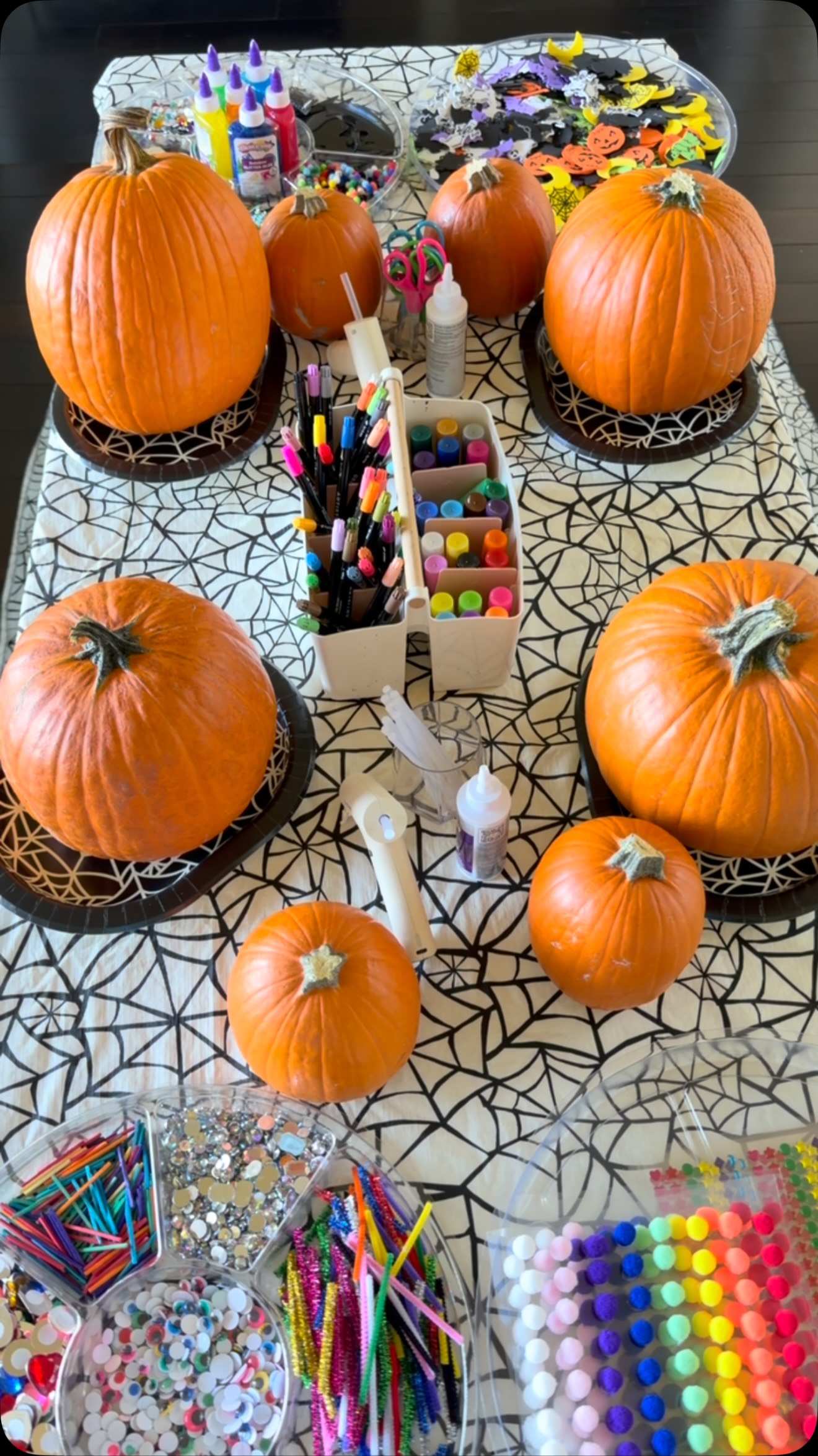 Pumpkin Decorating Party// Pumpkin decorating is one of my favorite ways to celebrate the magic of fall! For this festive invitation, each child had their own pumpkin to transform with an abundance of colorful, sparkly & spooky loose parts. Rather than providing a design to copy, the experience was completely open-ended, giving children the freedom to experiment, make choices & create a pumpkin uniquely their own.
The Tinker Trays were filled with @discountschoolsupply @colorationsart Halloween foam shapes, adhesive & sparkly pom-poms, sequins, small & large adhesive rhinestones, iridescent gems, wooden mosaic tiles, colorful craft sticks, wooden shapes, adhesive googly eyes, gem stickers, glitter glue & sparkly & regular pipe cleaners. I also provided tempera paint sticks, acrylic paint markers, scissors, fast-drying tacky glue & a hot glue gun with adult assistance.
With pumpkins as their canvas, children could draw, layer, arrange, glue & redesign as their ideas evolved. Beyond being a festive fall tradition, this invitation naturally encouraged fine-motor development, hand-eye coordination, creative thinking, decision-making, patterning & self-expression.
No templates. No two pumpkins alike. Just an abundance of materials & endless possibilities to tinker, create & make a little Halloween magic! #tinkerwonderplay #processartforkids #halloweenactivities #halloweenactivitiesforkids #pumpkindecorating