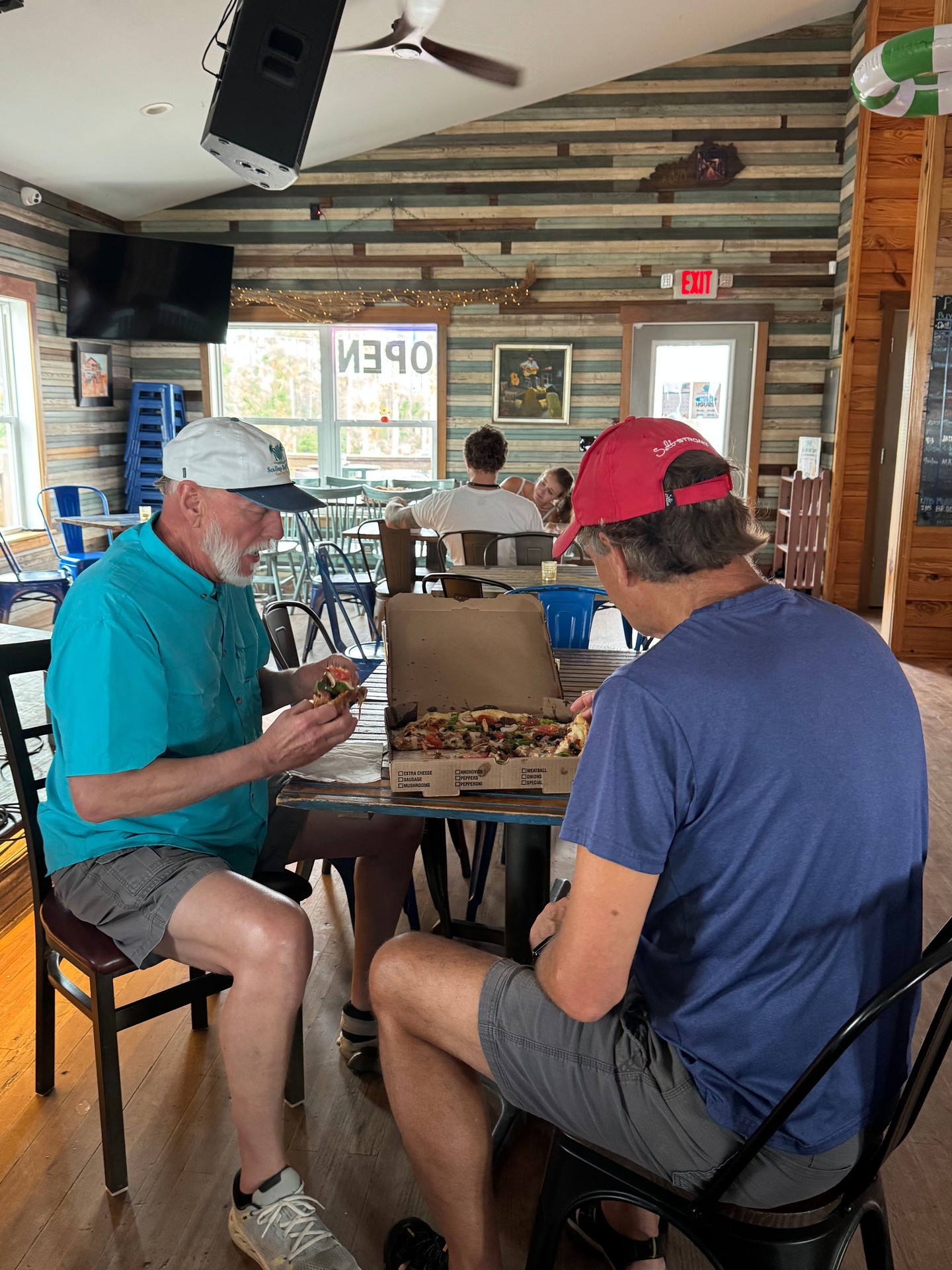 Sometimes the best plans are the simple ones — pizza on the table, a cold drink nearby, and nowhere you need to rush off to.