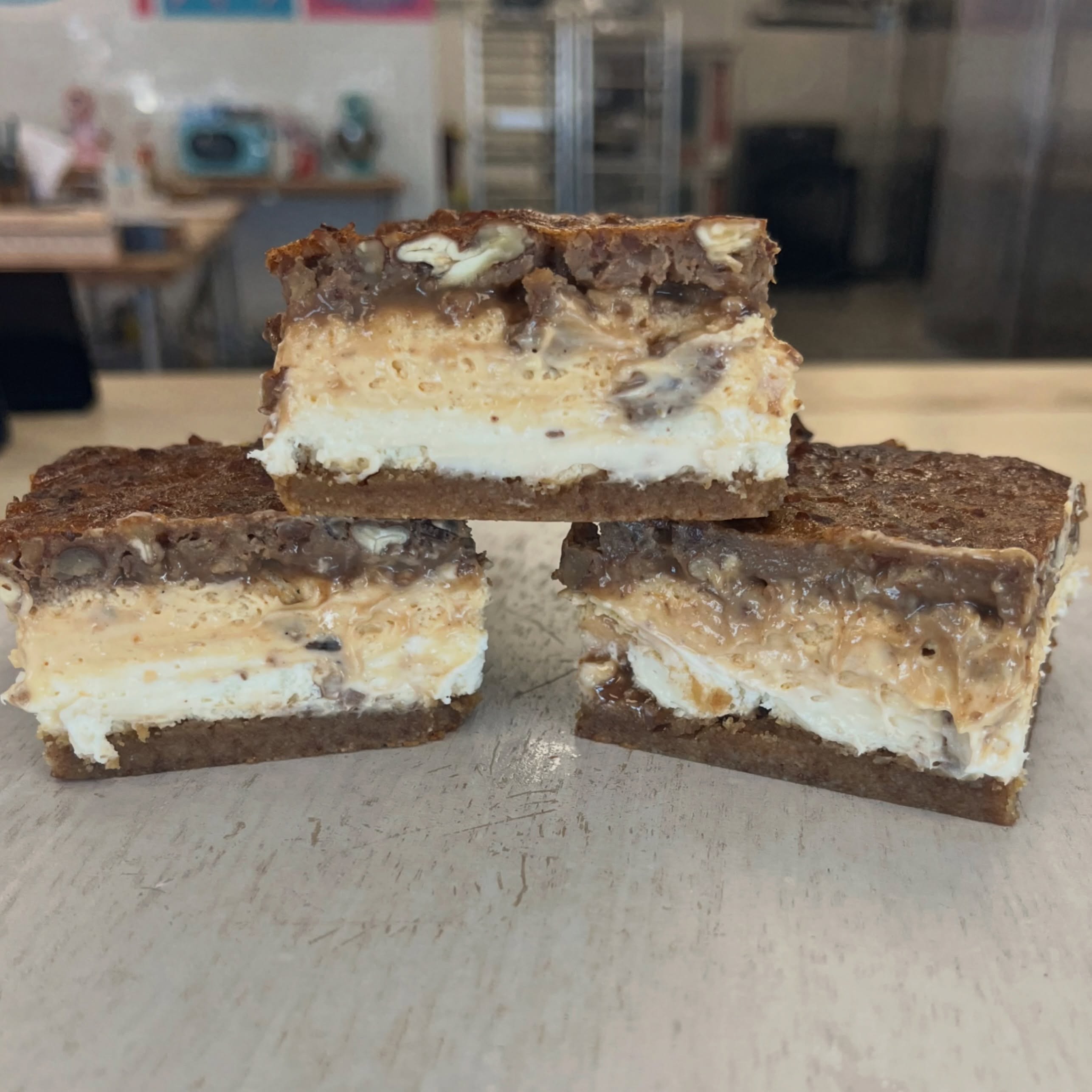 🍂🎃 GET READY, SINLESS SWEETS FAMILY!!! 🎃🍂
THIS is a dessert you DO NOT want to miss!!! 🤤
If you loved our famous BUTTER PECAN CHEESECAKE BARS, you are going to FLIP over our brand-new PUMPKIN BUTTER PECAN CHEESECAKE BARS!!! 🍁🥧
Layers upon layers of fall goodness:
✨ Our buttery brown butter crust
✨ Creamy vanilla cheesecake
✨ Delicious pumpkin cheesecake
✨ And topped with our BAKED BUTTER PECAN PIE TOPPING!!! 🌰
This bar is seriously NEXT LEVEL. 🔥
WALK, DON’T RUN!!! 🏃♀️💨 These are NOW AVAILABLE in our showcase, and you do NOT want to miss them!
📍 4336 Washington Rd, Suite B, Evans, GA
Come get your fall fix!!! 🍂🤎
Treats without the cheats!