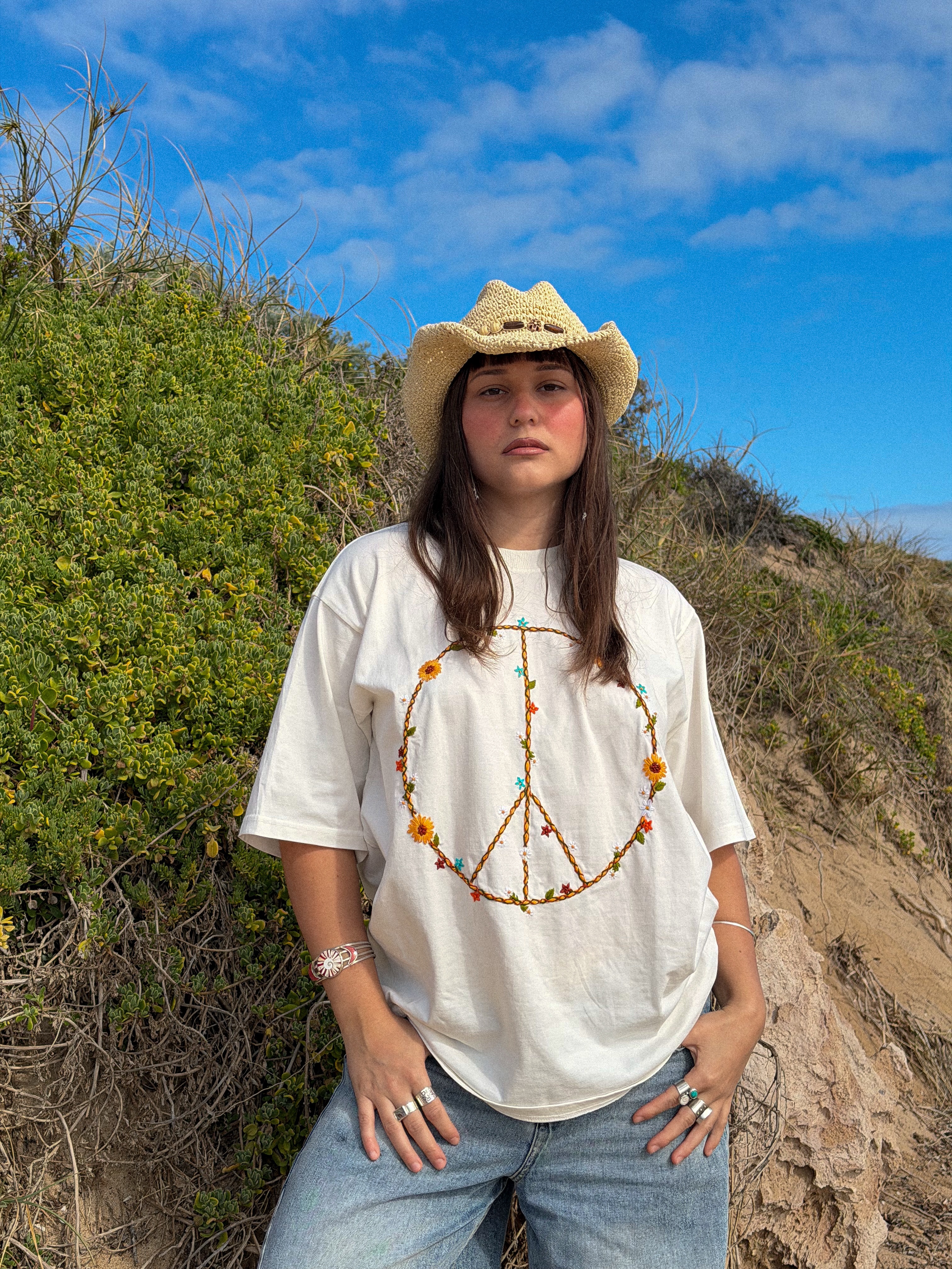 Yes to oversized Tees 🙌🙌
Our Woven in PEACE Tee is hand embroidered by our talented artisans creating a pretty floral garland with ✌️☮️…. love love 🫶